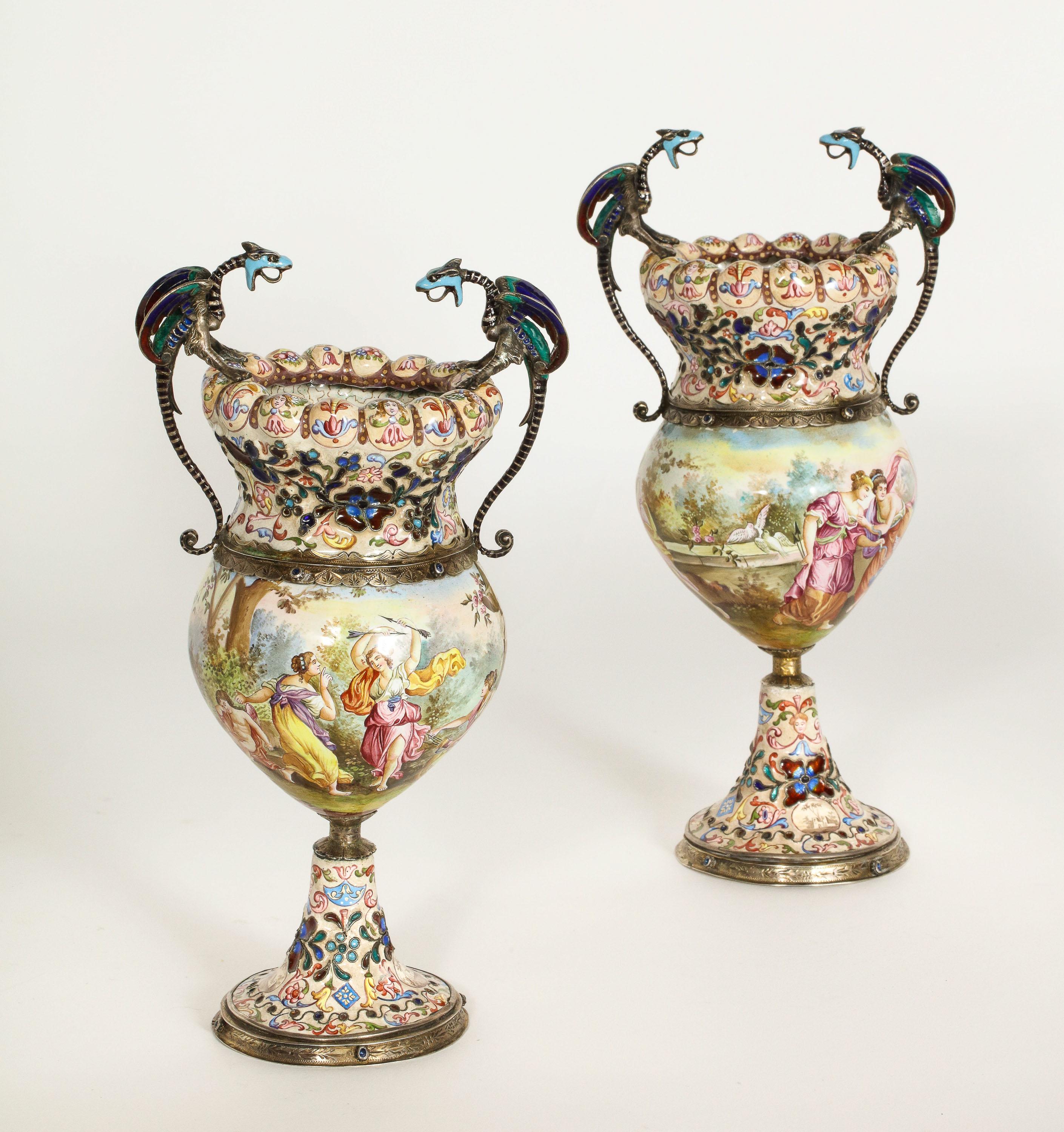 Hermann Bohm, a fine pair of Viennese Austrian silver-mounted enamel vases, circa 1870.

Very nice quality, with dragon handles and very finely painted with classical scenes.

Hallmarked throughout. 

Good condition, no chips, cracks, or