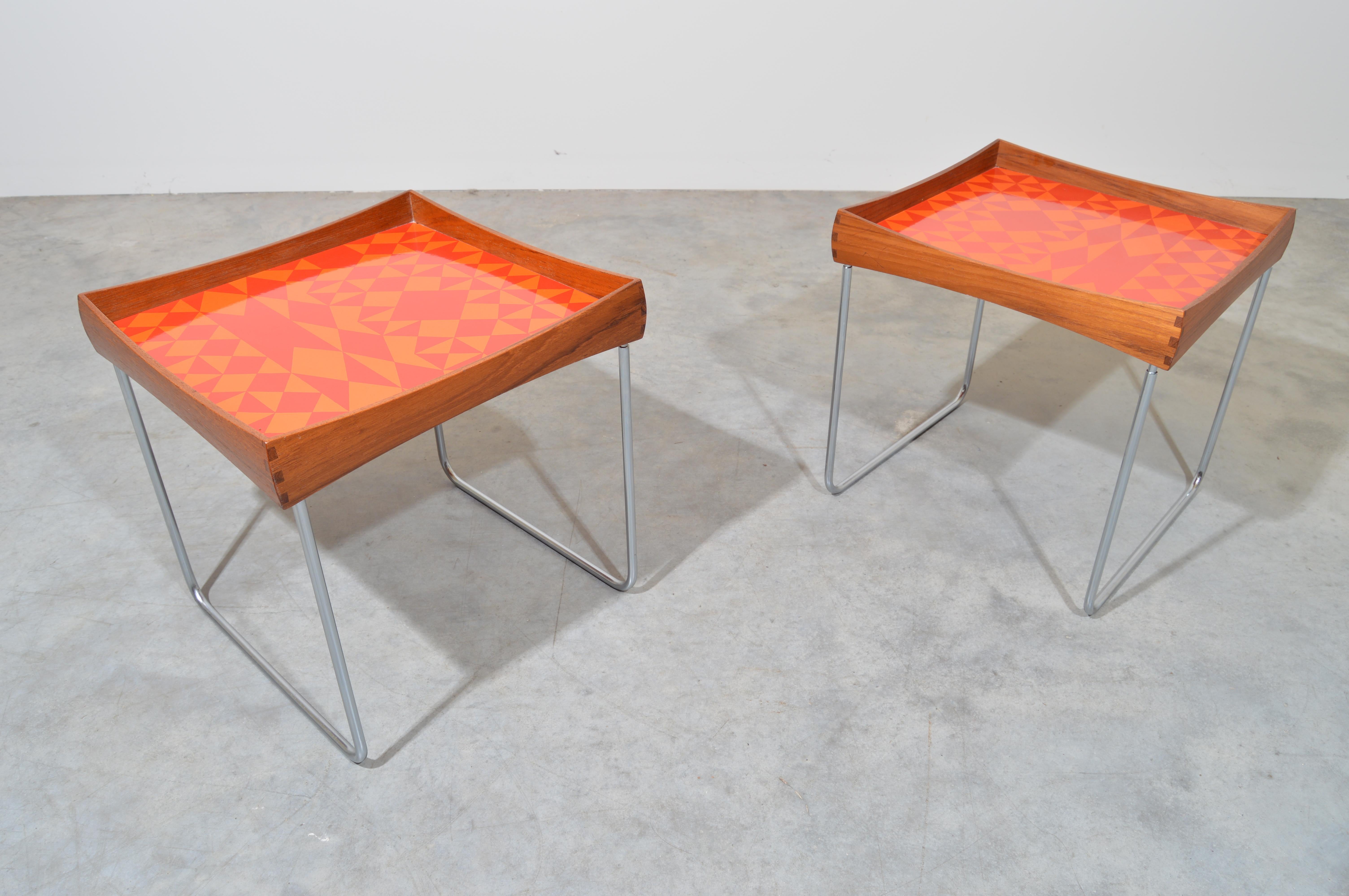 A matched pair of Norwegian enamel tray tables by Hermann Bongard for Plus, circa 1960s. Beautifully executed, removable tray tops in teak with dove tail joinery and an abstract enamel pattern. Legs collapse for easy storage.
Outstanding overall
