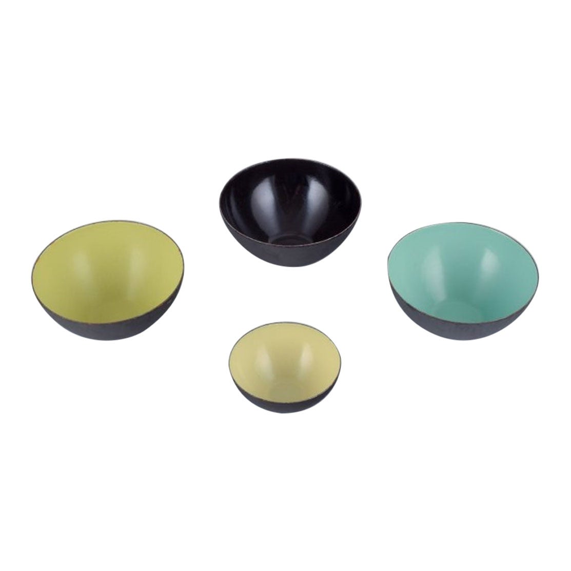 A. Hermann Krenchel. Quattro ciotole in metallo Krenit con smalto nero, verde e giallo