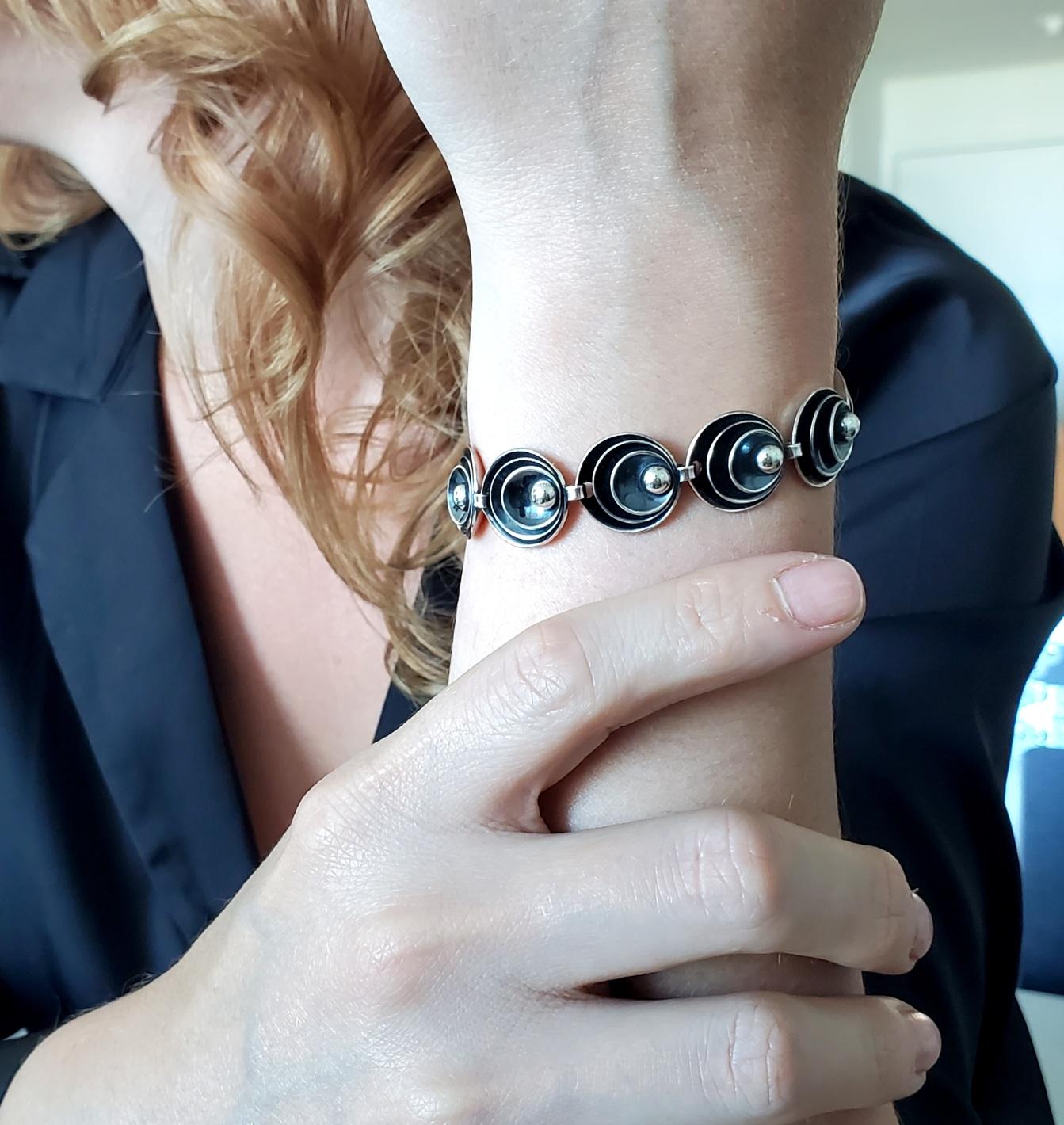 An Op Art bracelet designed by Hermann Siersbol.

An easy to wear everyday bracelet, created in Copenhagen Denmark by Hermann Siersbol, back in the 1960s. It was crafted with optical art patterns in solid sterling silver .925/.999 with polished and