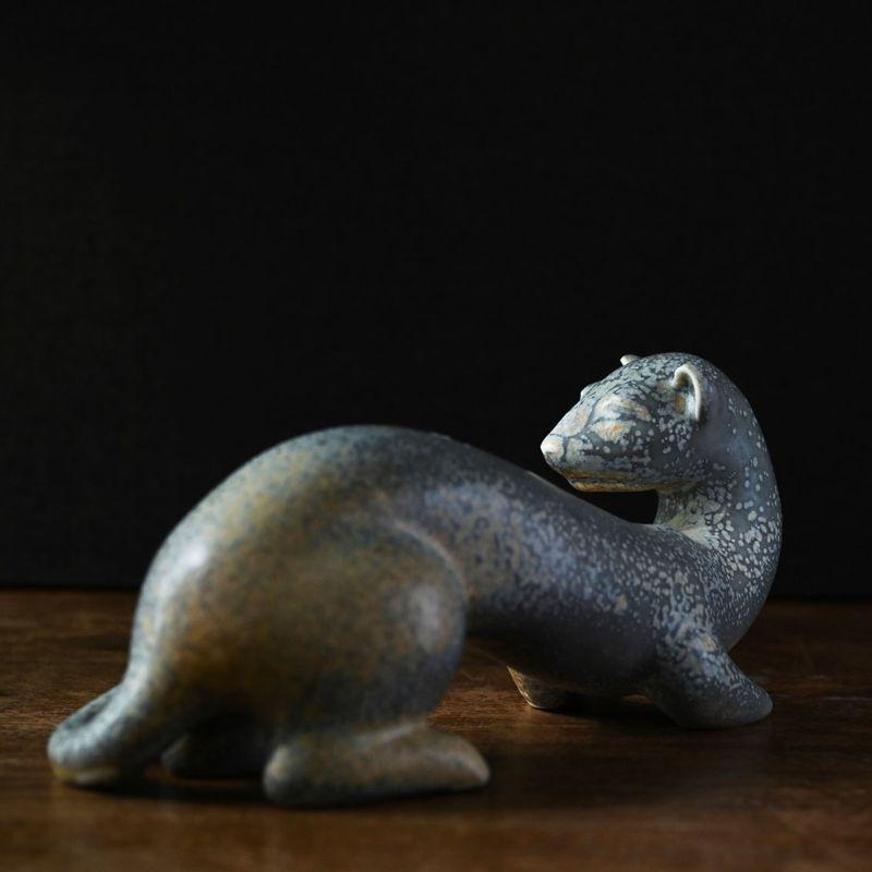 Hermelin Figurine in ceramic by Gunnar Nylund

Stoneware figurine from Rörstrand.

Additional information:
Material: Ceramic
Artist: Gunnar Nylund
Size: 23.5 W X 9.5 D X 11 H cm.