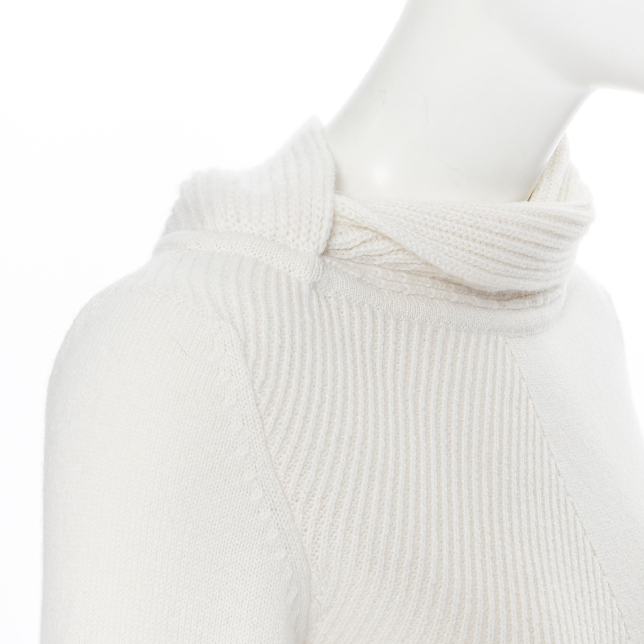 HERMES 100% cashmere ivory beige ribbed knit silver H charm sweater FR34 XS
Brand: Hermes
Model Name / Style: Sweater
Material: Cashmere
Color: Beige
Pattern: Solid
Extra Detail: Asymmetric wrap high collar. Textured ribbing panel at front right