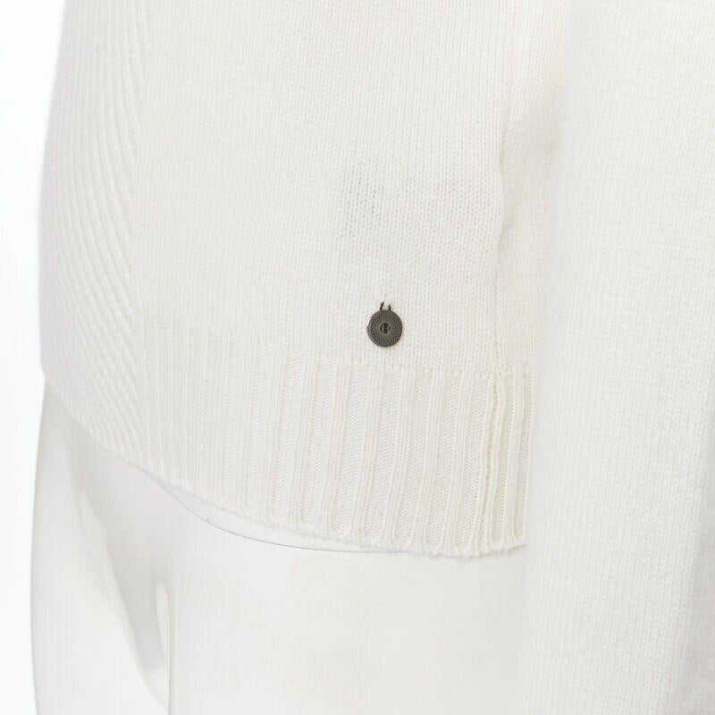 HERMES 100% cashmere ivory beige ribbed panel silver H charm sweater FR34 XS
Reference: SNKO/A00026
Brand: Hermes
Model: Sweater
Material: Cashmere
Color: Beige
Pattern: Solid
Extra Details: Wide neckline. Diagonal ribbing panel at front centre.