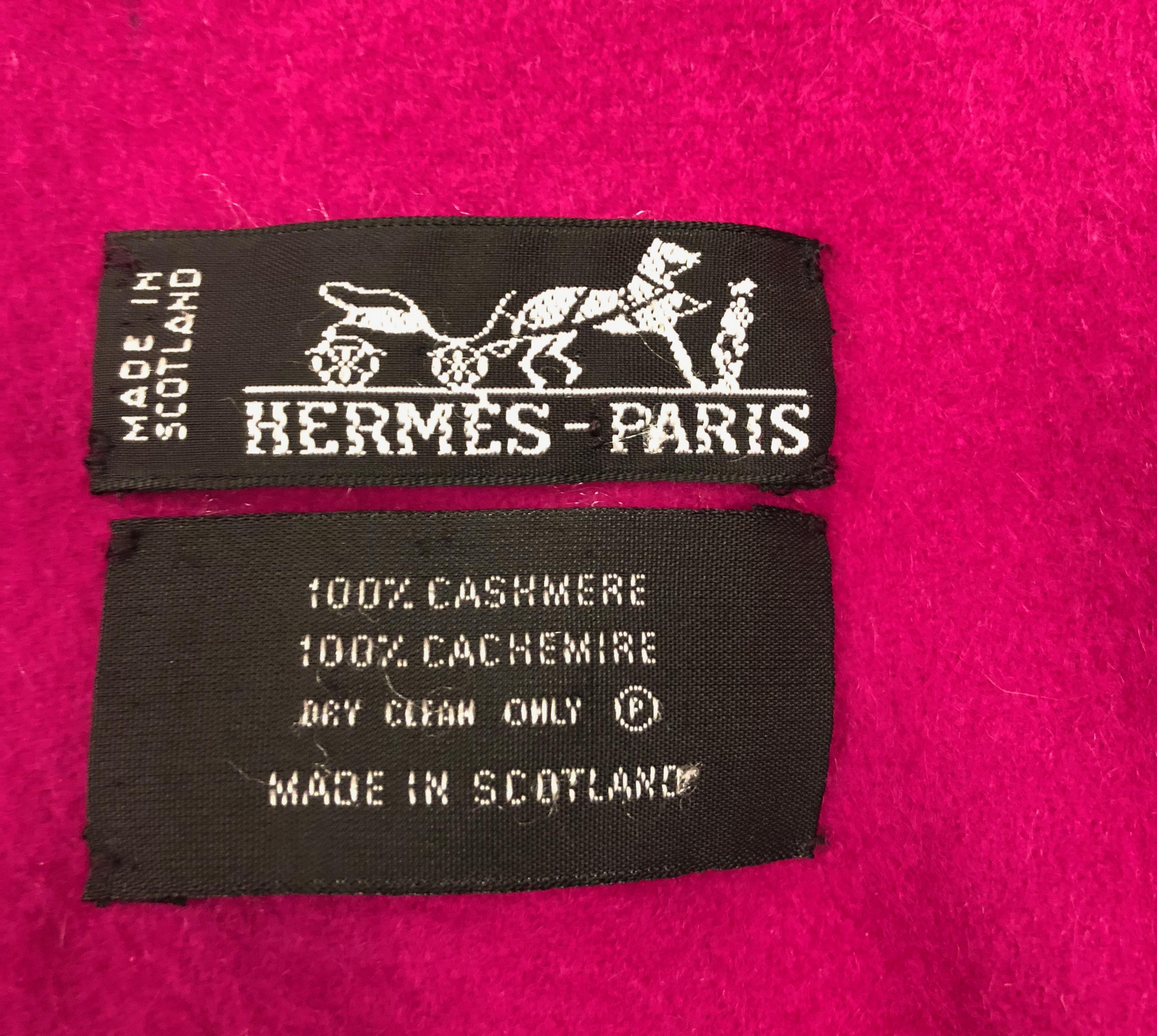 Presented here is a beautiful Hermes Cashmere shawl. The shawl is a most wonderful shade of magenta. It is 70 inches long with an additional  3 inches of fringe on each end making it aa total of 76 inches long and 27 inches wide. On the bottom right