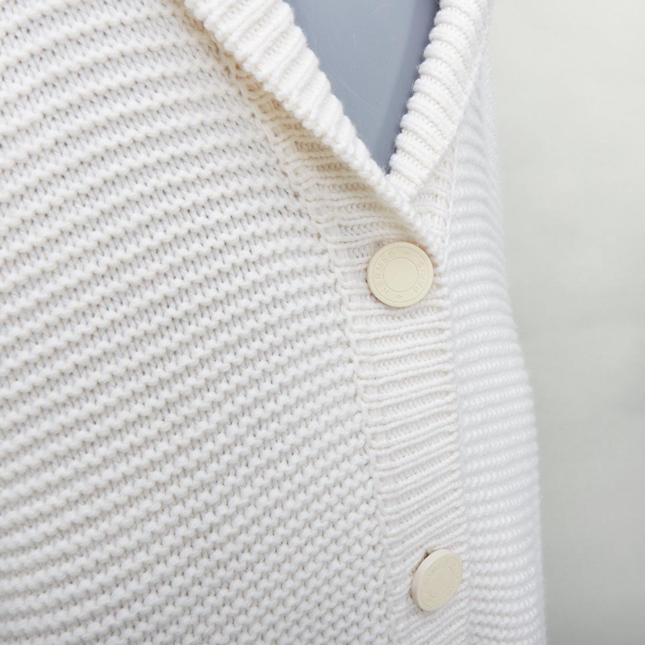 HERMES 100% cashmere off white leather logo buttons oversized cardigan FR34 XS
Reference: KYCG/A00076
Brand: Hermes
Material: 100% Cashmere
Color: Cream
Pattern: Solid
Closure: Button
Extra Details: Logo leather buttons. Patchwork knitted back.
Made