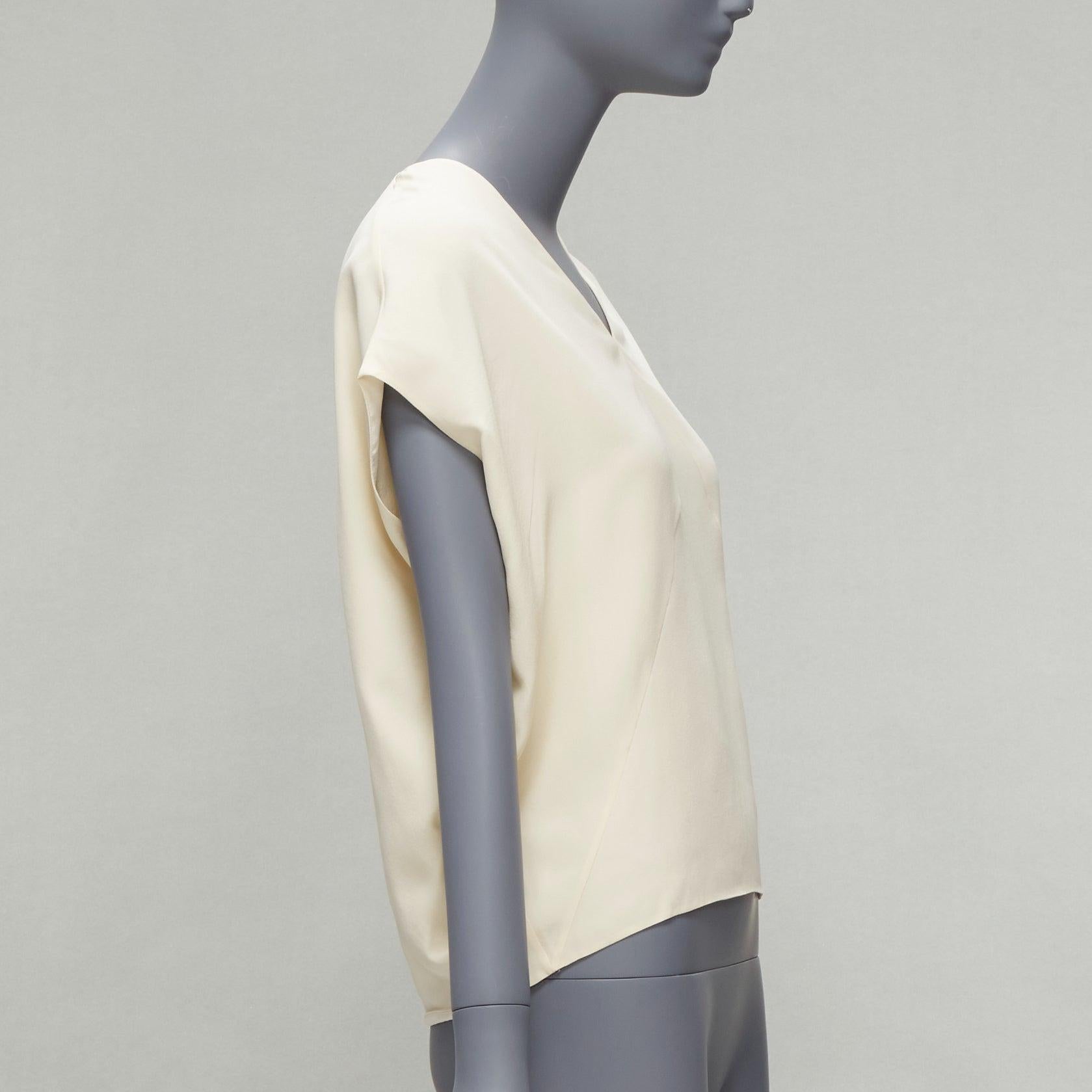 HERMES 100% Seide elfenbeinfarbenes Fledermausflügel-Top mit V-Ausschnitt und H-Logo-Stickerei FR34 XS Damen