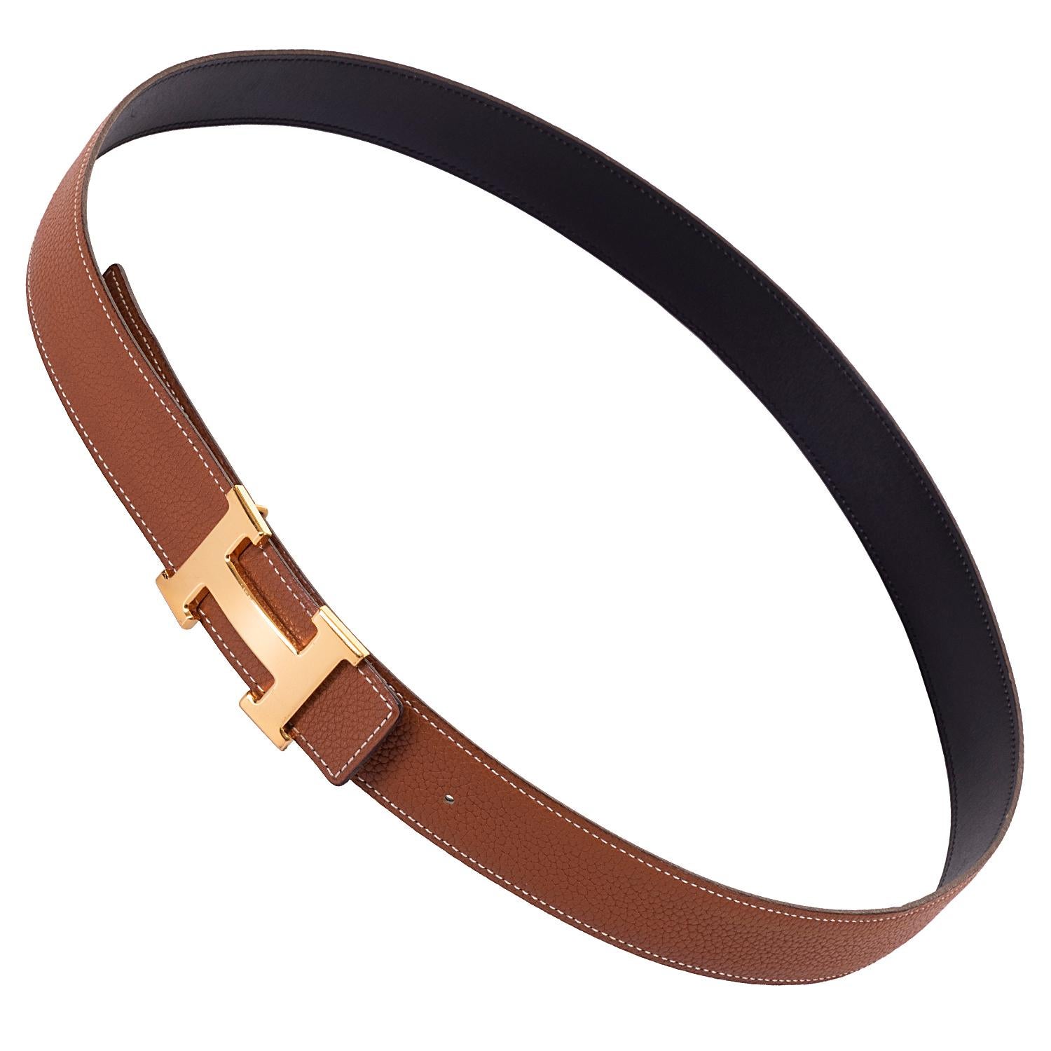 A Superb Hermes Men's Reversible Belt, in excellent condition, accented with the classic Hermes Gold 'H' Buckle. Measuring 100cm (to fit waist sizes 38in. to 40in.) the belt has black Box leather to one side, with grained Sabel Togo leather to the