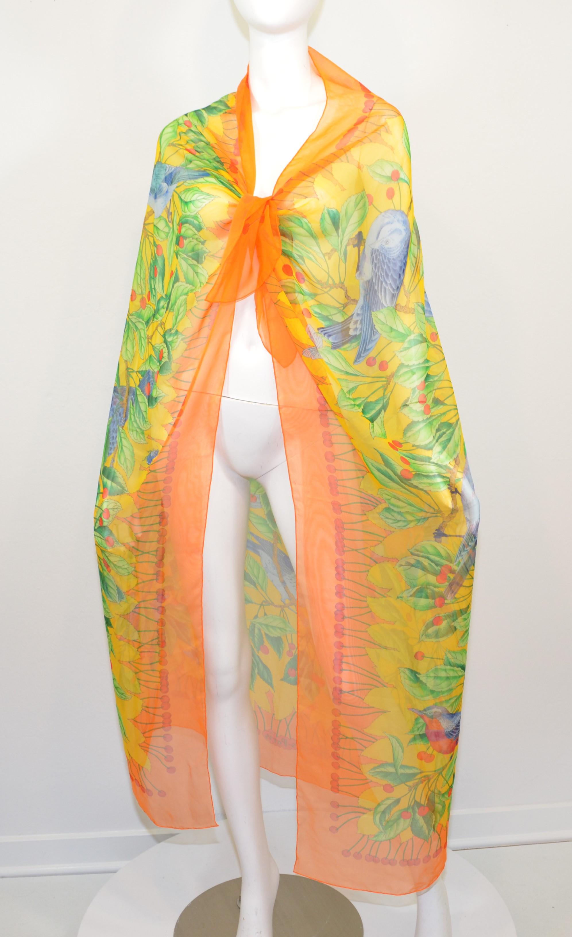 Hermes 140cm xl silk/chiffon scarf featured in orange with a multi-color bird and cherry print throughout with 