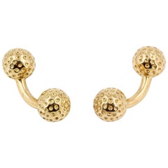 Hermès - Boutons de manchette en or 18 carats avec balle de golf et haltère