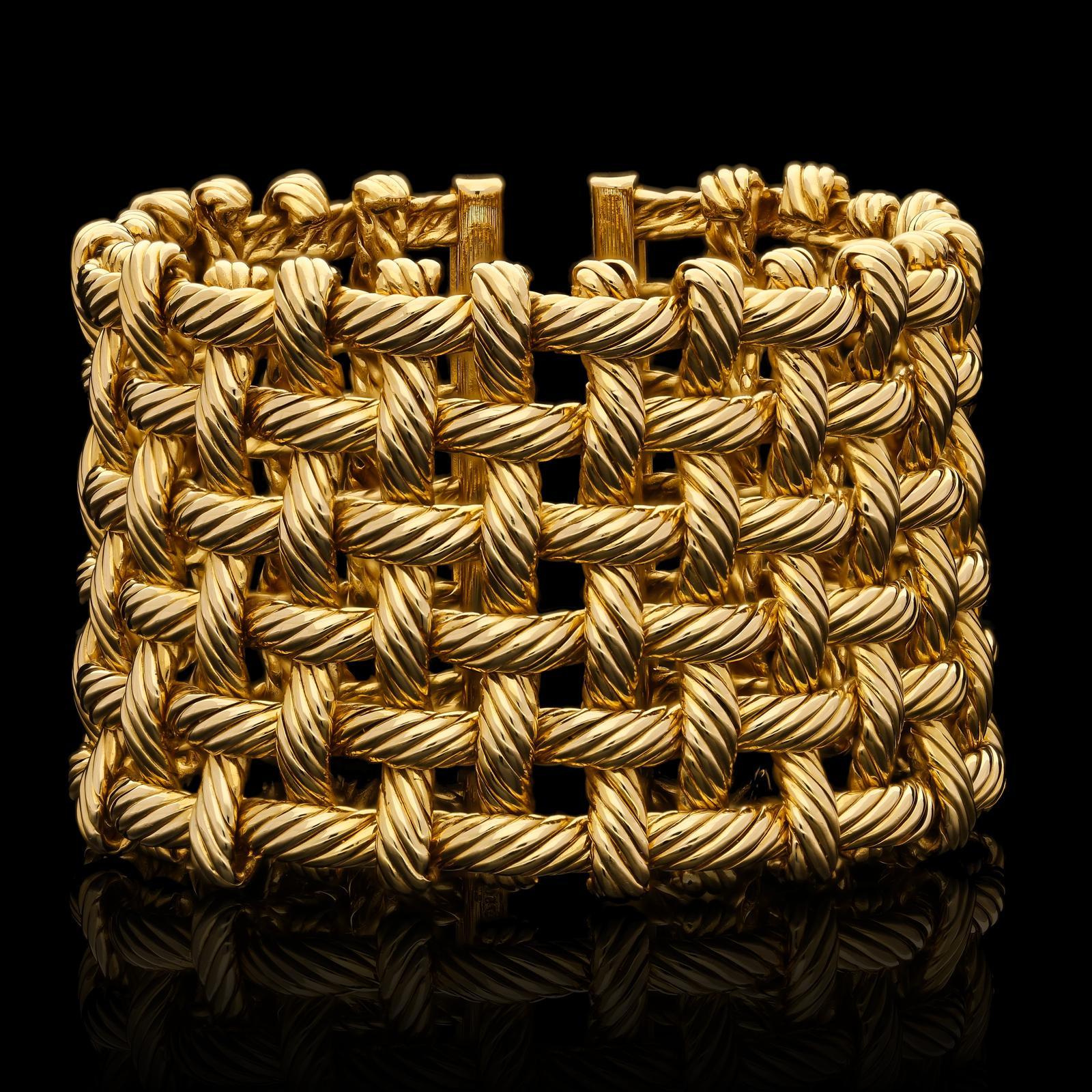 Description
A wonderful wide French gold cuff bracelet by Hermes c.2000s, the bracelet of open work basket weave design with a textured twist finish to the gold, the twenty three upright strands are interwoven with six horizontal strands in a loose