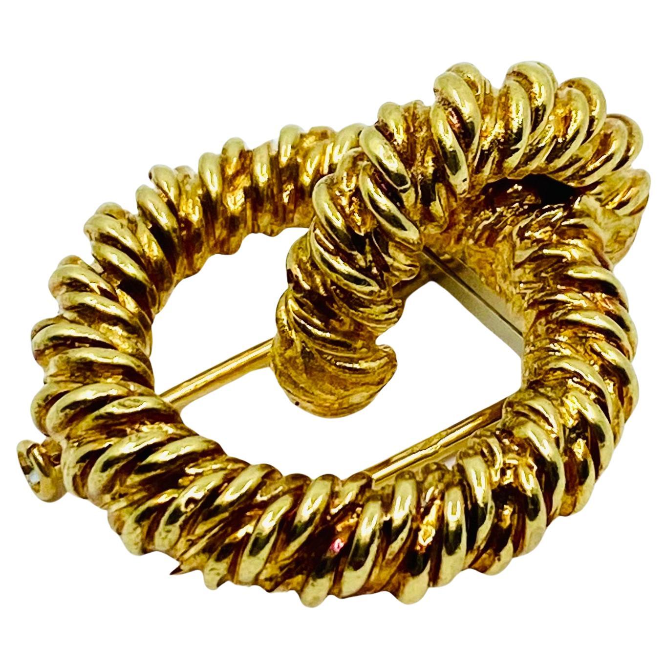 Broche vintage Hermès en or 18k à nœuds en vente 1
