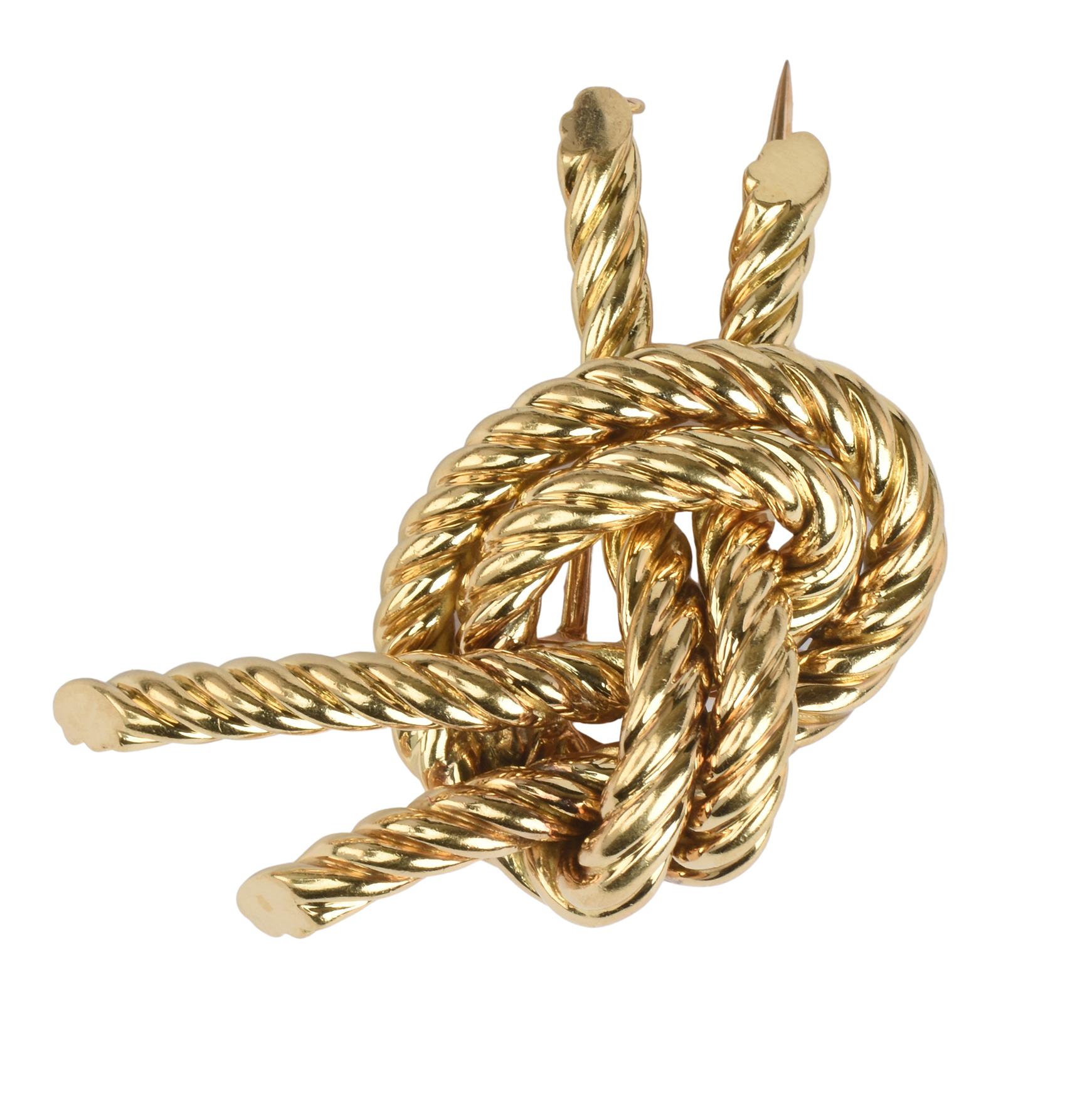 A vintage 18k yellow gold Hermès tied gold knot rope design brooch by Georges L'Enfant.

Made in France, Paris, Circa 1960’s.

French marks 18k,  Marked Hermes Paris