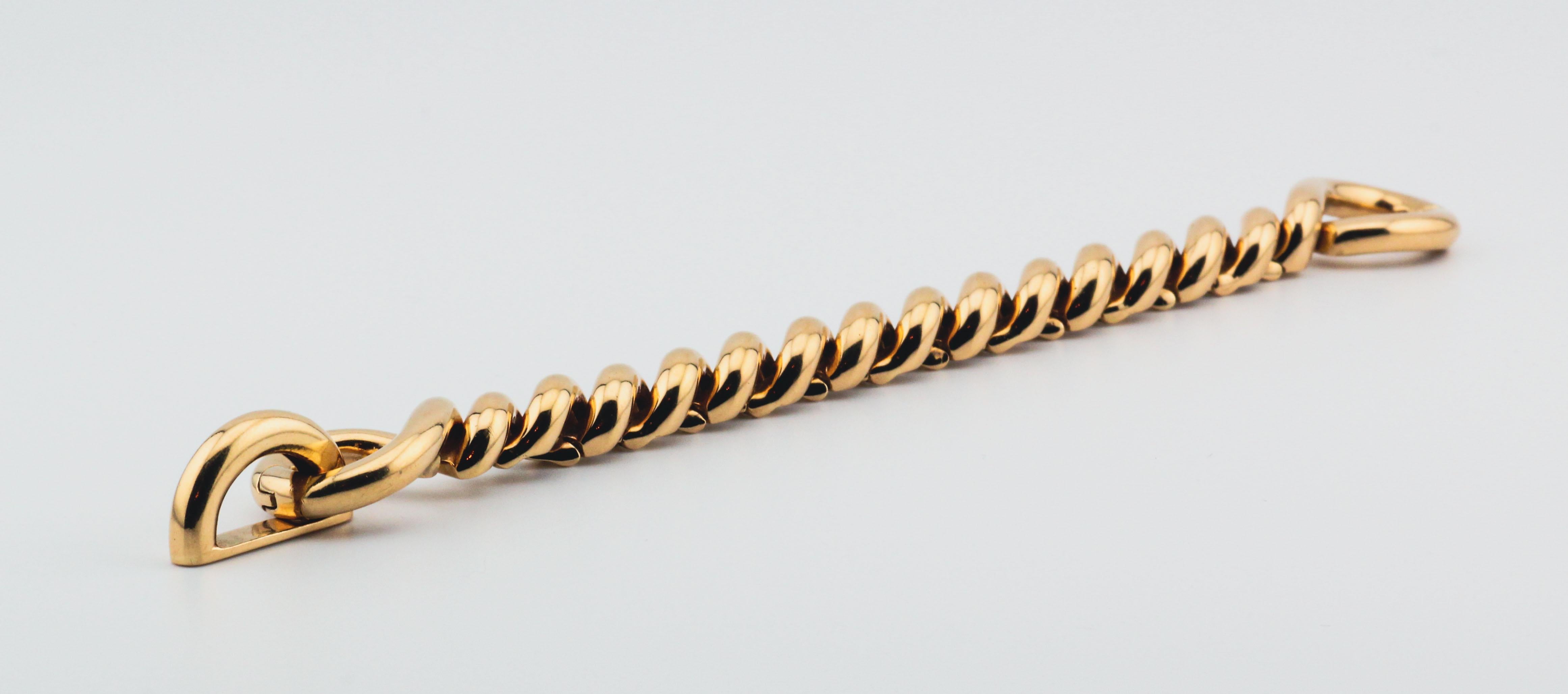 Fine and scarce 18K gold torsade link bracelet by Hermes, circa 1980s. 

The Hermes 18k gold torsade link bracelet is a stunning piece of jewelry that exudes elegance and sophistication. Made from 
high-quality 18k gold, this bracelet is expertly