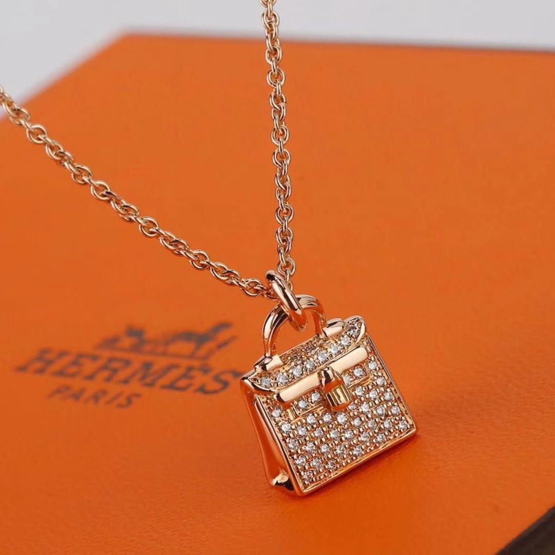 hermes kelly amulette pendant