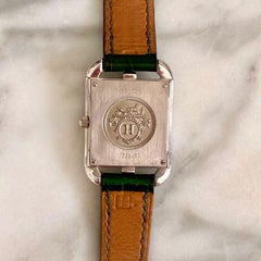 Hermès 18 Karat White Gold Quartz Watch with Emerald and Diamond Surround