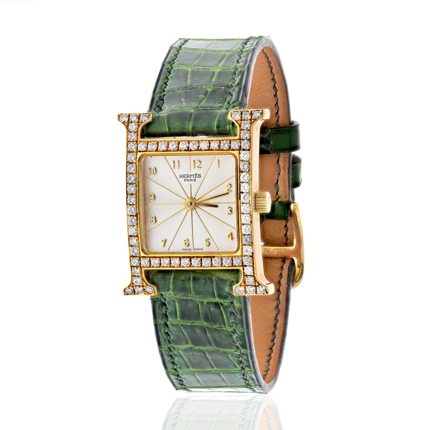 Hermes 18K Yellow Gold Heure H 21mm HH 1.286 Ladies Diamond Watch.

18k yellow gold set with round diamonds (0.90ct approx.), 21x30 mm
Dial: white 
Movement: quartz, made in Switzerland
Functions: hours, minutes
Cream number dial.
Tang