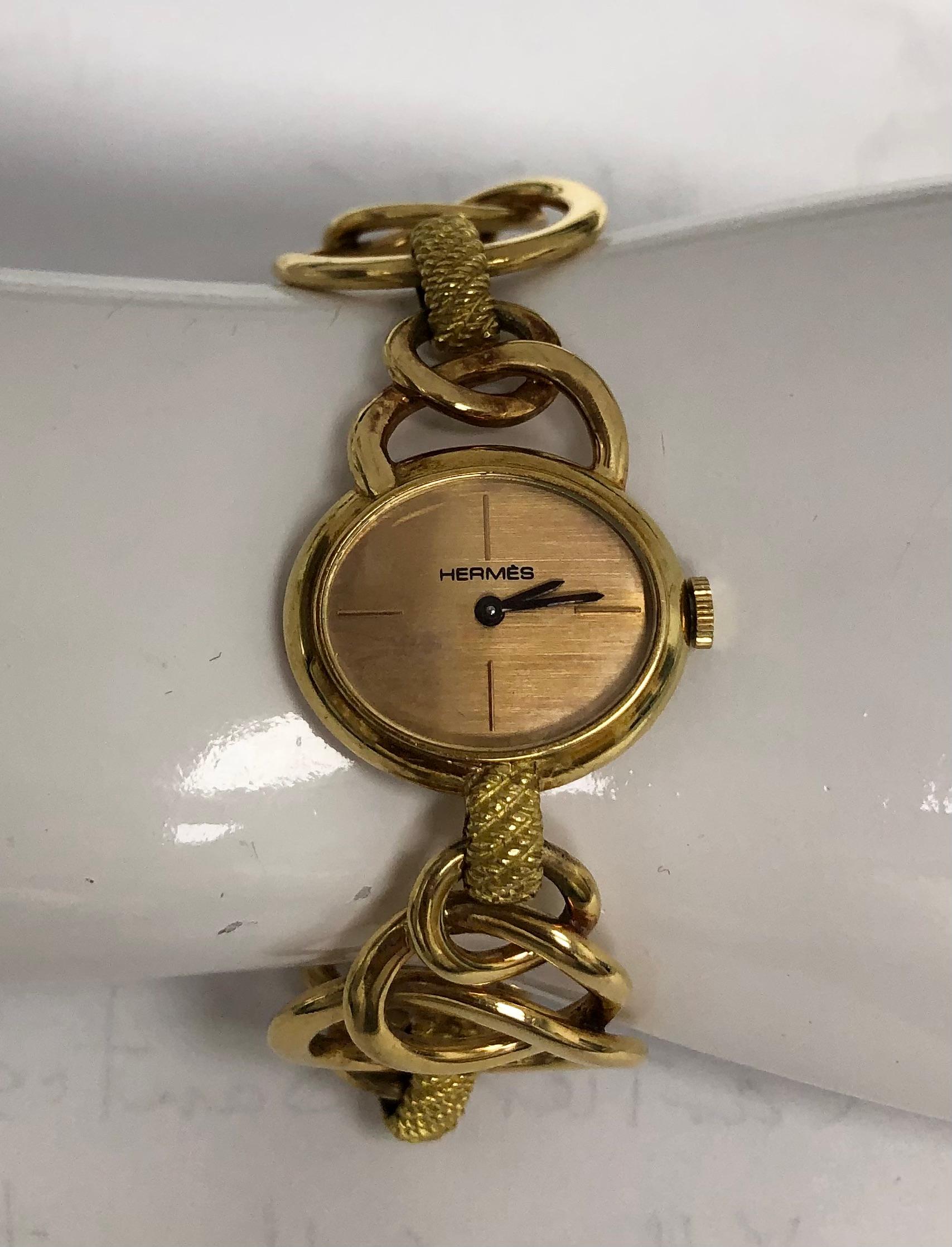 Vintage 1960' Hermes 18K yellow gold bracelet watch. Oval dial manual winding, weight: 72.6g.