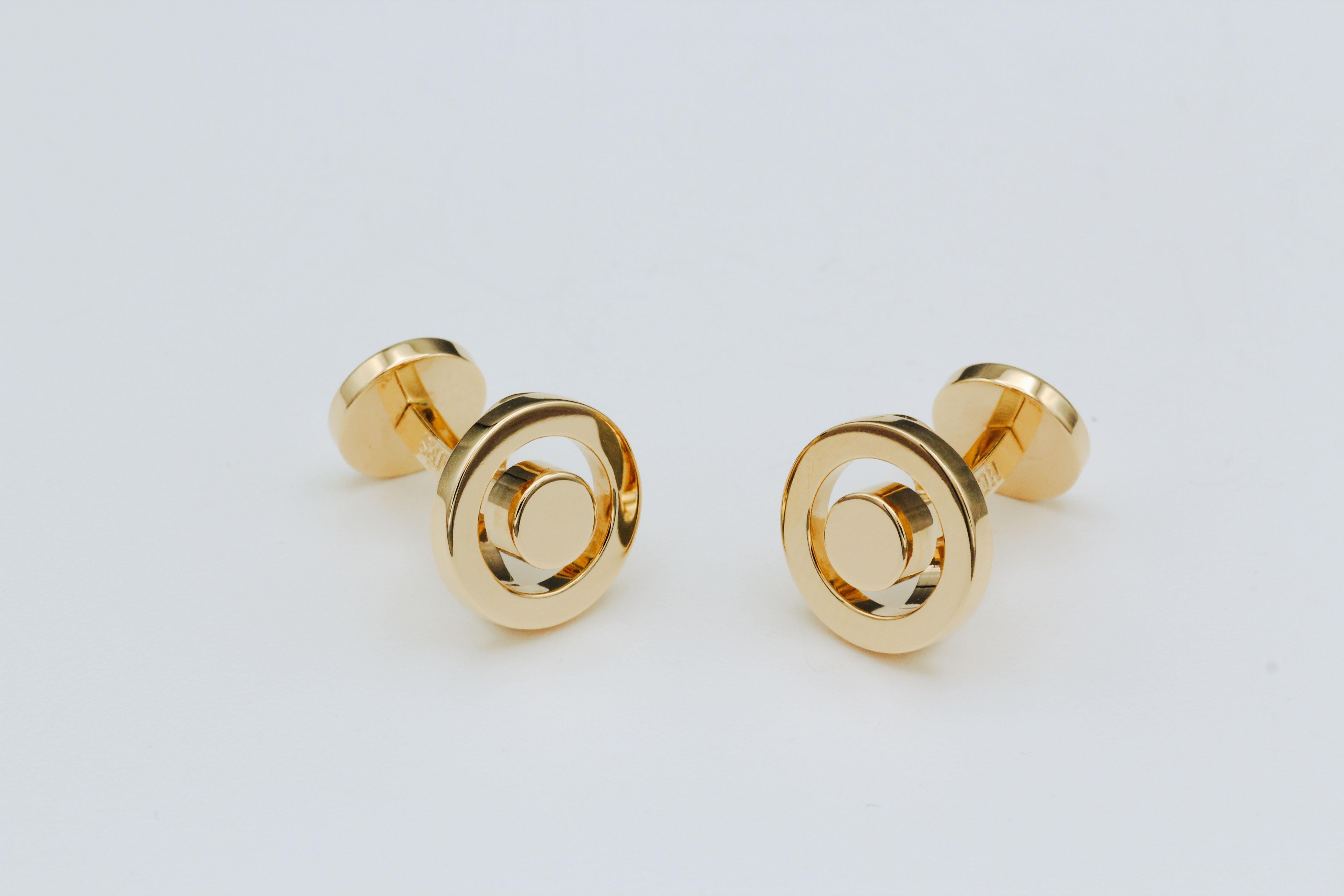 Elevate your sense of style with these Modern Hermes 18k Yellow Gold Round Bullseye Cufflinks, an exquisite embodiment of luxury and sophistication. Crafted with the utmost precision and attention to detail, these cufflinks are a testament to the