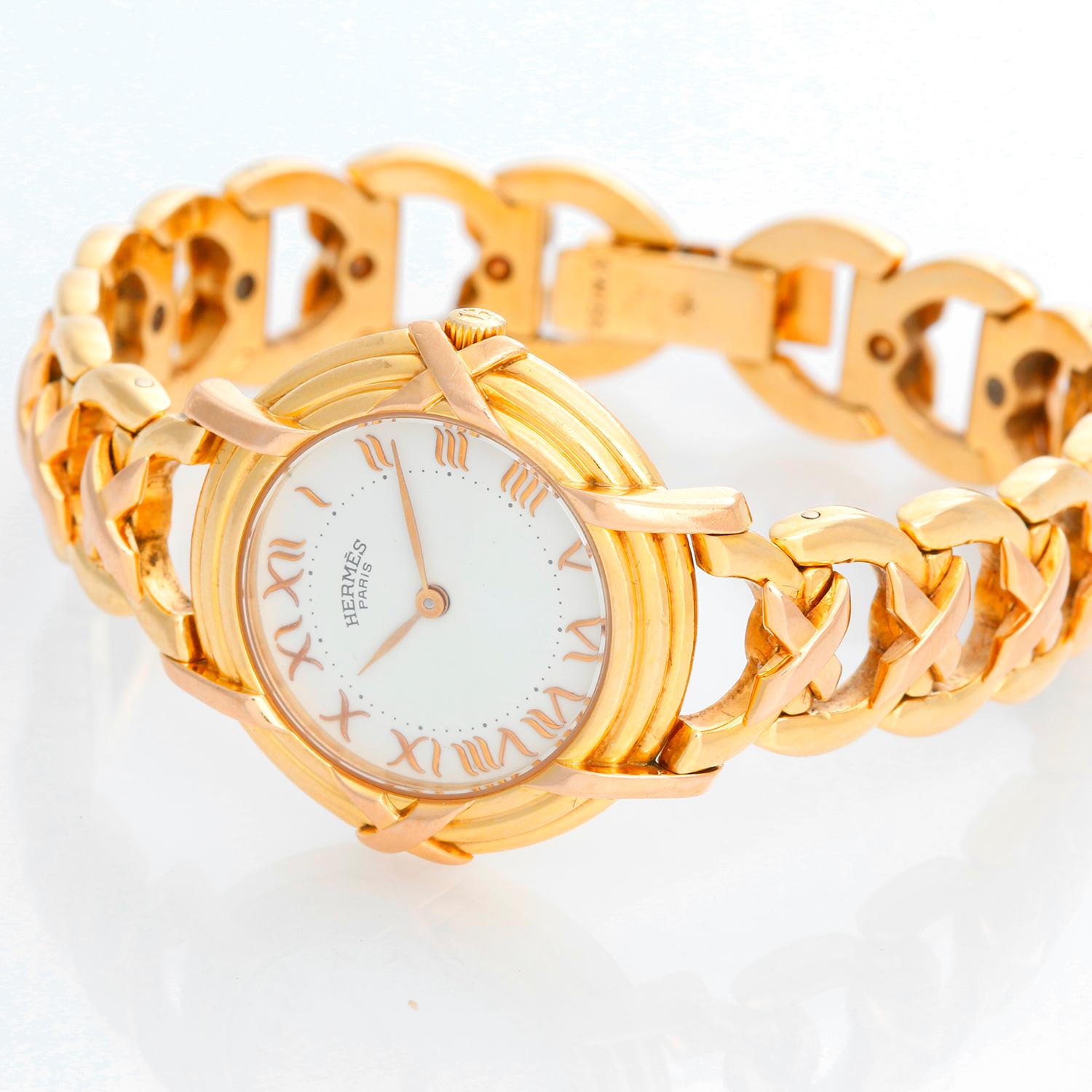 Hermes 18K Yellow Gold Ruban Ladies Watch  - Quartz. 18K Yellow gold ( 26 mm ) . White dial with Roman numerals . 18K yellow gold link bracelet . Pre-owned with custom box .