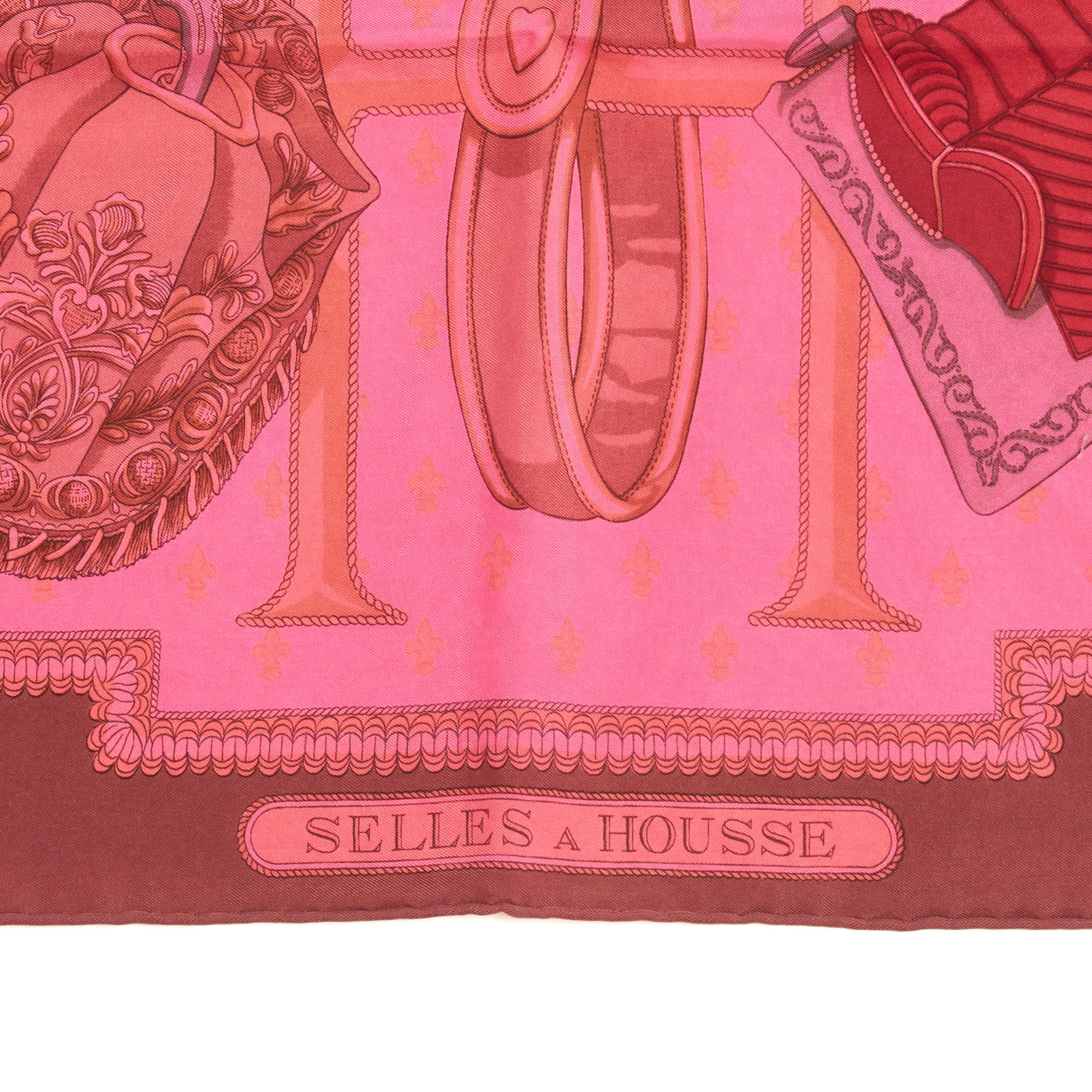 Hermès square scarf 90 in silk twill, Selles à housse motif by Christiane Vauzelle, published in 1967 and never reissued, patterns in ecru, gold and Hermès red tones with medium brown edges, recently re-dyed at Hermès in shades of pink. Width 90 cm