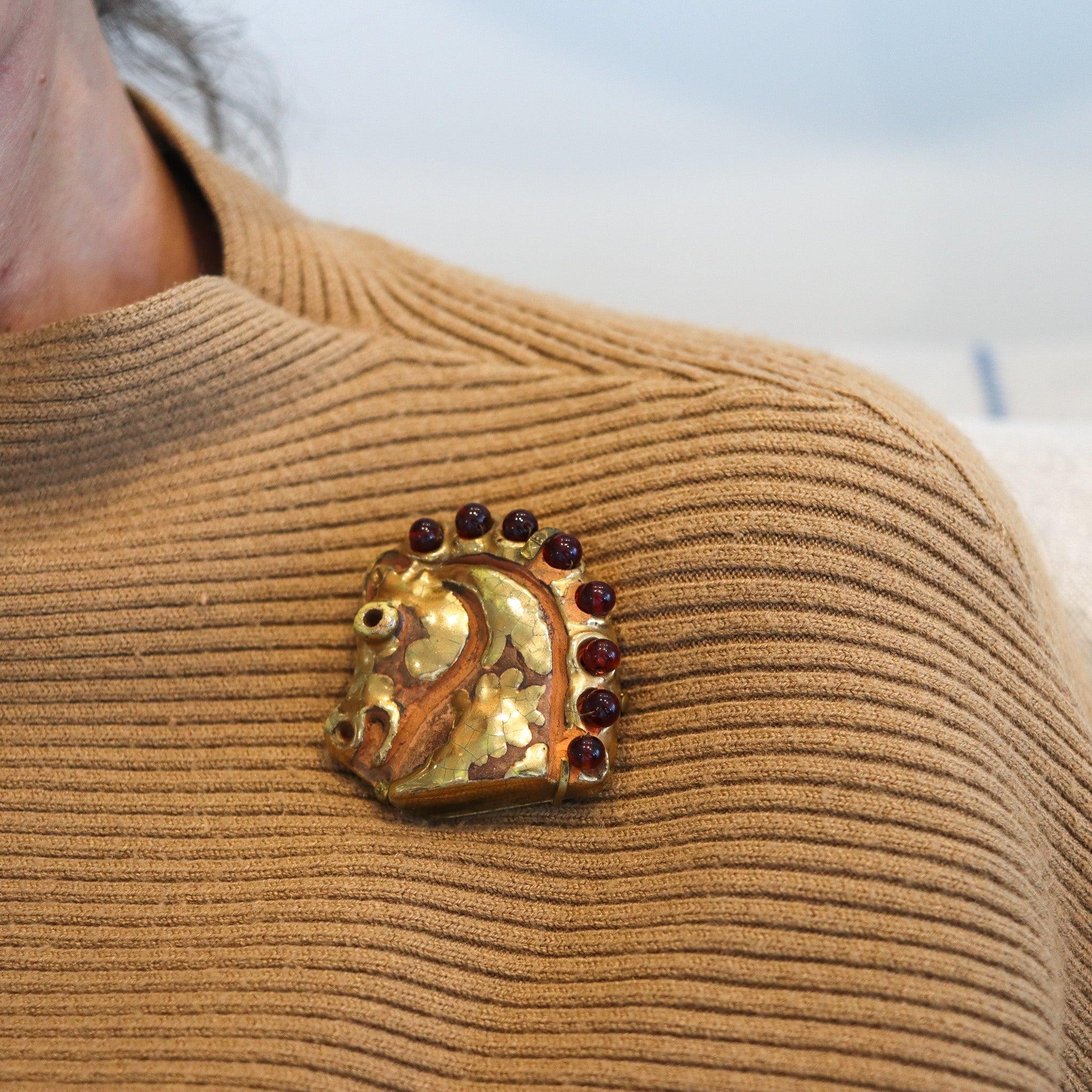 A horse head brooch designed by Aldo Londi for Hermes Paris.

This is a very rare whimsical horse brooch, created in Paris France by the luxury house of Hermes, back in the 1970. The horse head was crafted Aldo Londi in glazed and gold gilt ceramic,