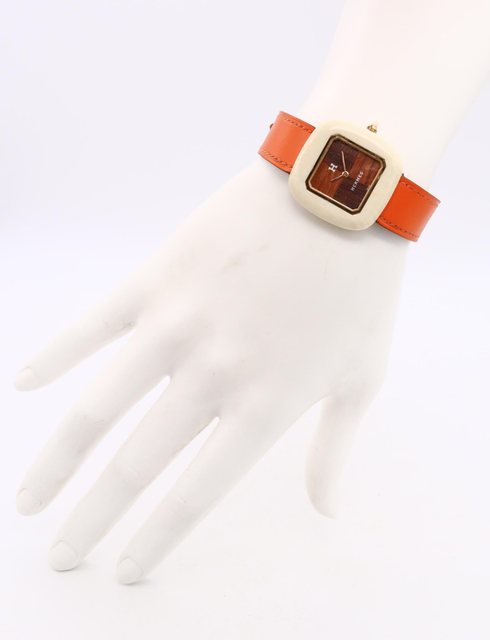 Rare vintage wristwatch designed by Hermes.

Very important collector's piece, created by the house of Hermes in Paris France, circa1970's.

The case of this wristwatch is crafted from a 30 mm by 30 mm square cushion shape, made in 18K yellow gold.