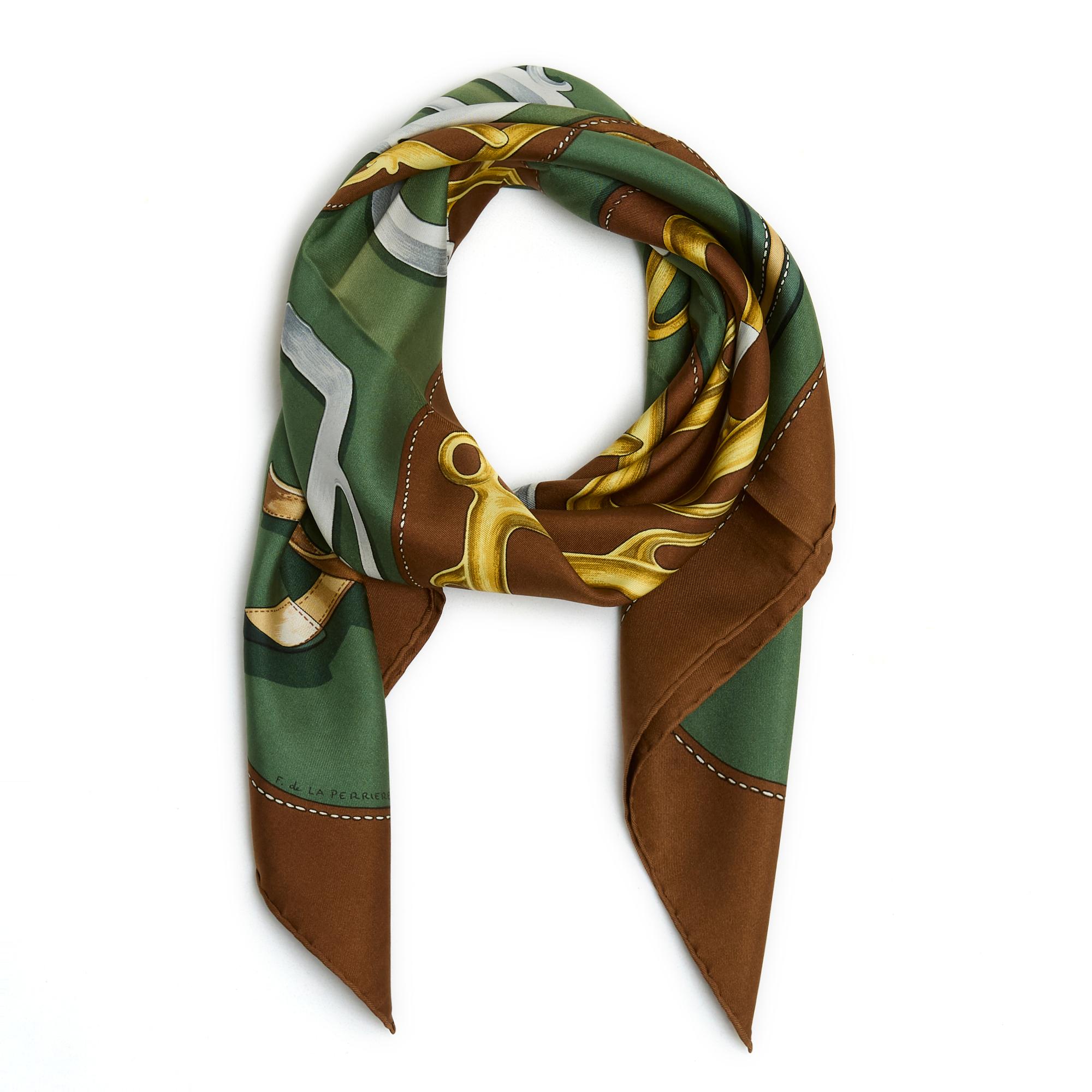 Hermès square scarf 90 in silk twill, Bouclerie d'Attelage pattern by Françoise de la Perrière, published in 1978 (and reissued as a square 70 in 2009), in shades of candied brown and gold, khaki edge. Width 90 cm x length 90 cm approximately. The