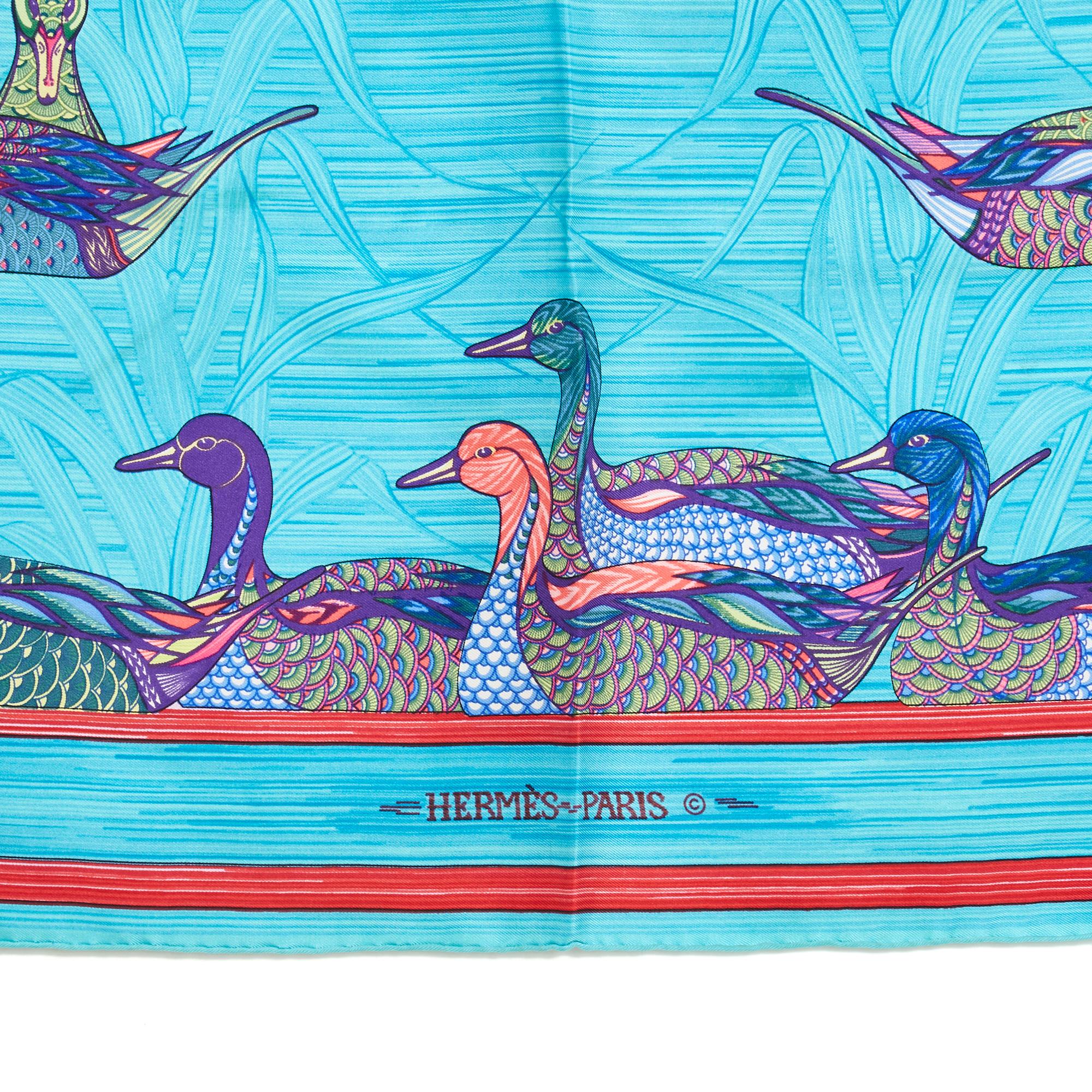 Hermès square scarf 90 in silk twill, La Mare aux Canards pattern by Daphné Duchesne, produced once only in 1980 in shades of blue with a dominant turquoise. Width 90 cm x length 90 cm approximately. The square has been worn but it seems in very
