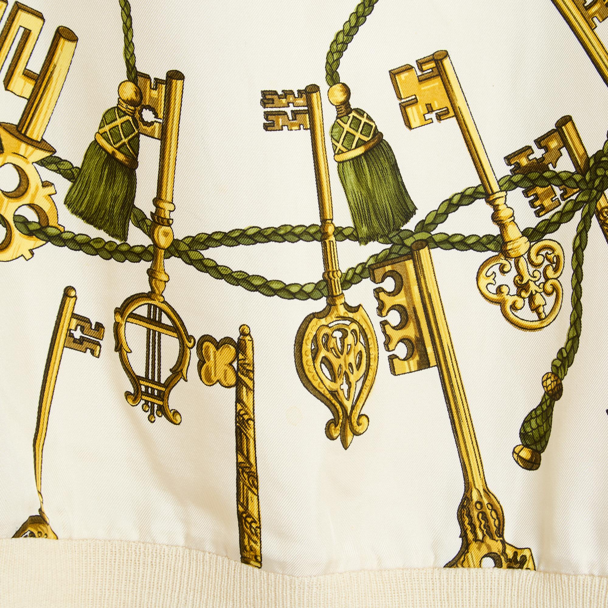 Hermès turtleneck sweater from the Twillaine series in ecru wool, front in silk twill with Les clefs motif by Cathy Latham (published in 1965 then 1980 - like this sweater and finally 2010), turtleneck closed with a zip at the shoulder in the doc ,