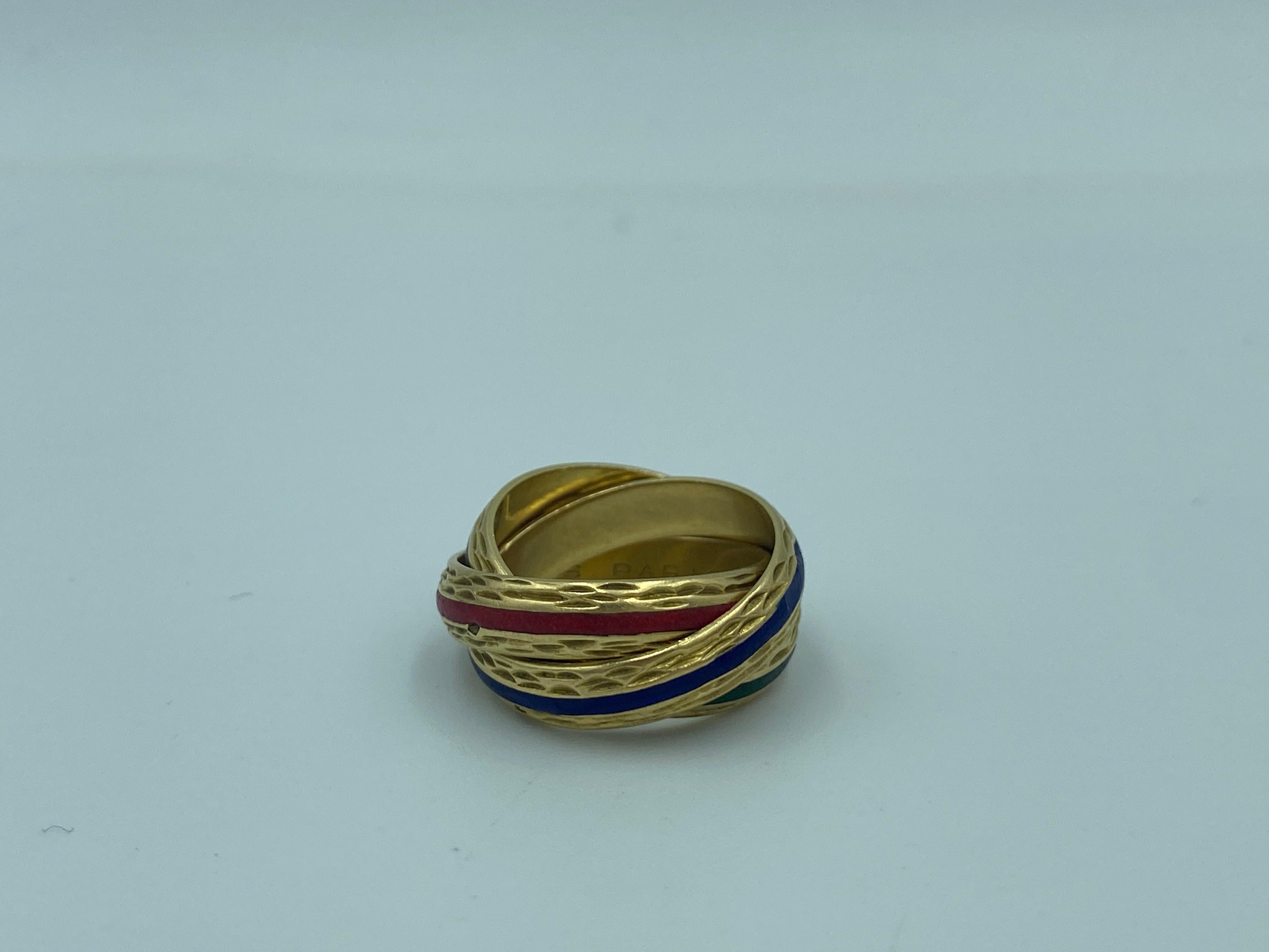 This graceful 1980s Hermes 18 carat gold trinity ring is a classic beauty. Each band has a different colour enamel, red, green and blue. It is a ring which you will not want to take off.