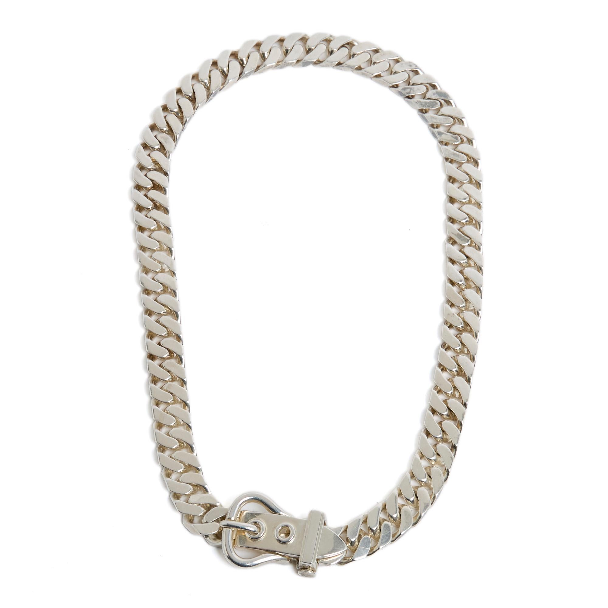 Hermès necklace model Gourmette or Belt circa 1980 in solid silver, gourmette link closed by a pin buckle with safety. Total length open 47.5 cm (not including the buckle), weight 162 gr. The hallmarks are visible but not the Hermès signature