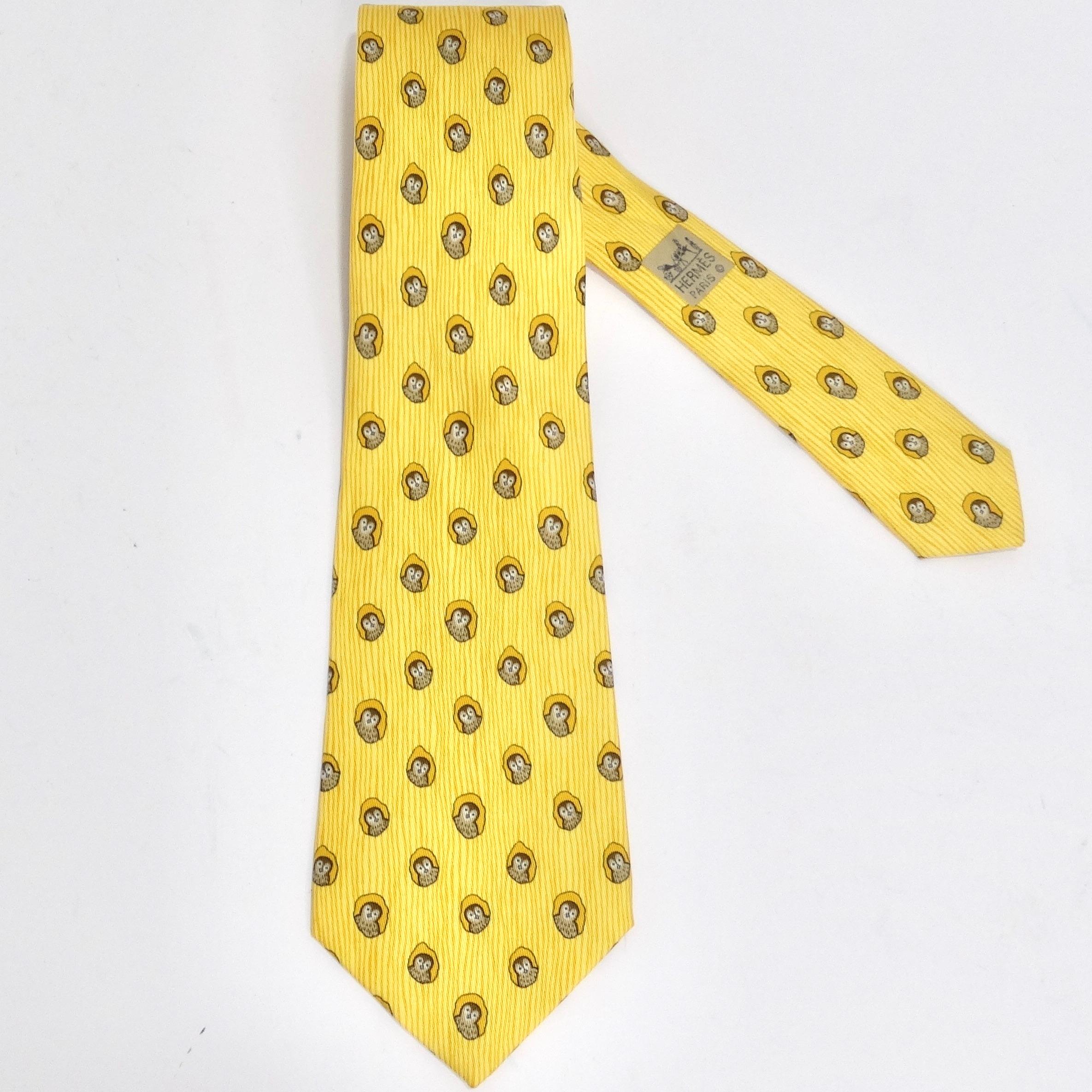 Introducing the Hermes 1990s Yellow Owl Print Tie – a classic closet staple with a playful twist! This tie combines timeless elegance with a vibrant pop of color and whimsy. The striking yellow silk is adorned with charming owl prints, making it a