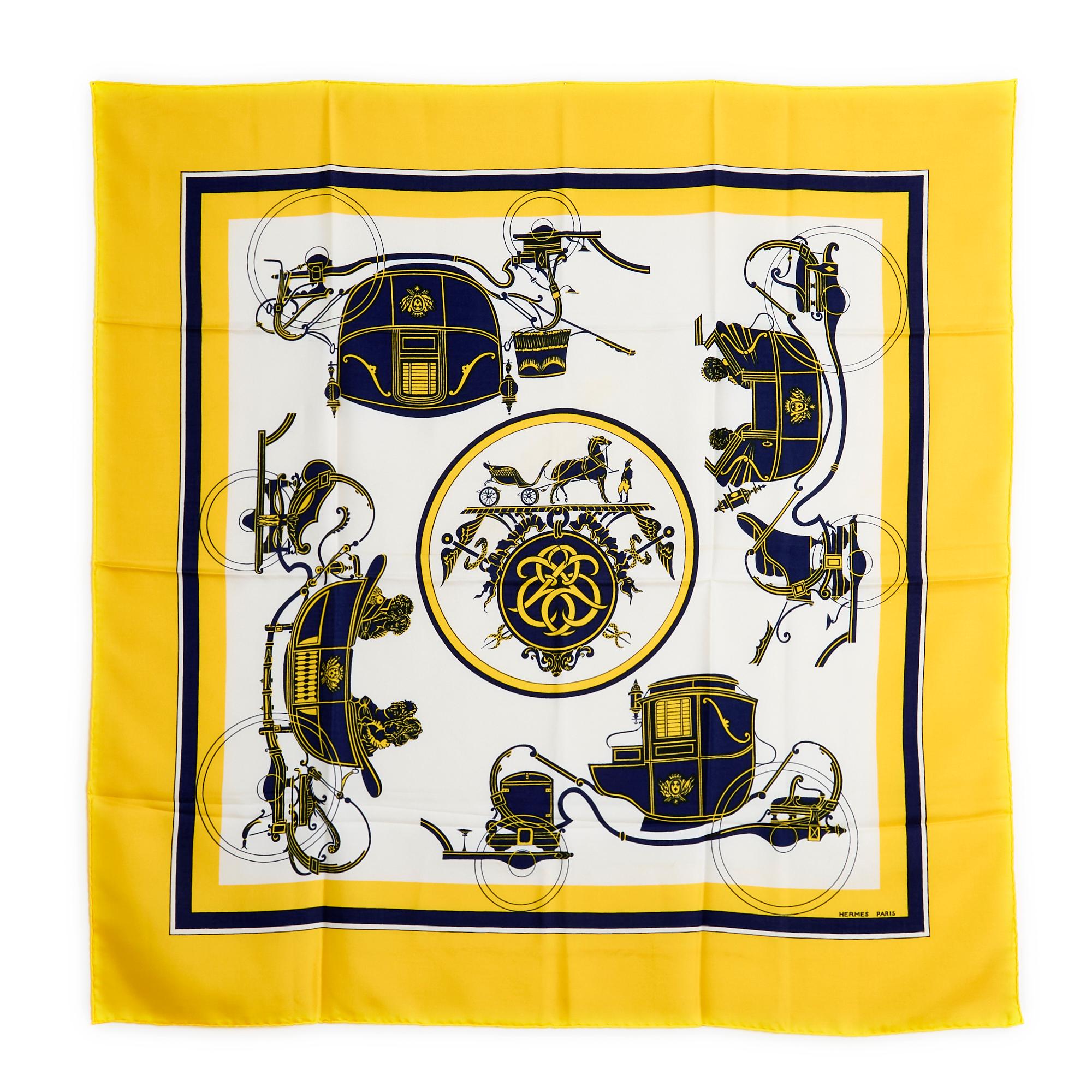 Hermès square 90 scarf in silk twill, Ex Libris pattern (originally created by Maurice-Emile Hermès in 1923) by Hugo Grygkar, published in 1996, reissued in 2004 then 2007, patterns in navy blue and yellow tones on background white, yellow edges.