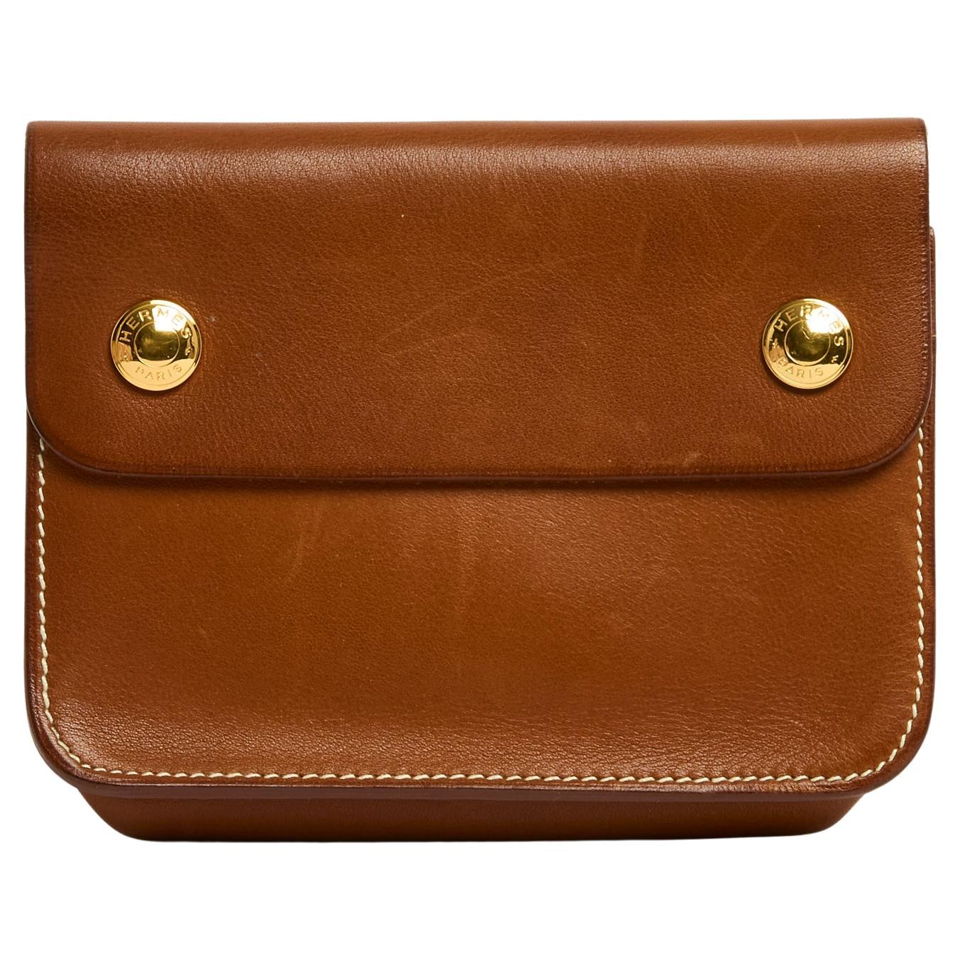 Hermès pouch on belt, Floride model, in Barenia leather (natural camel color) composed of a simple pouch closed with 2 