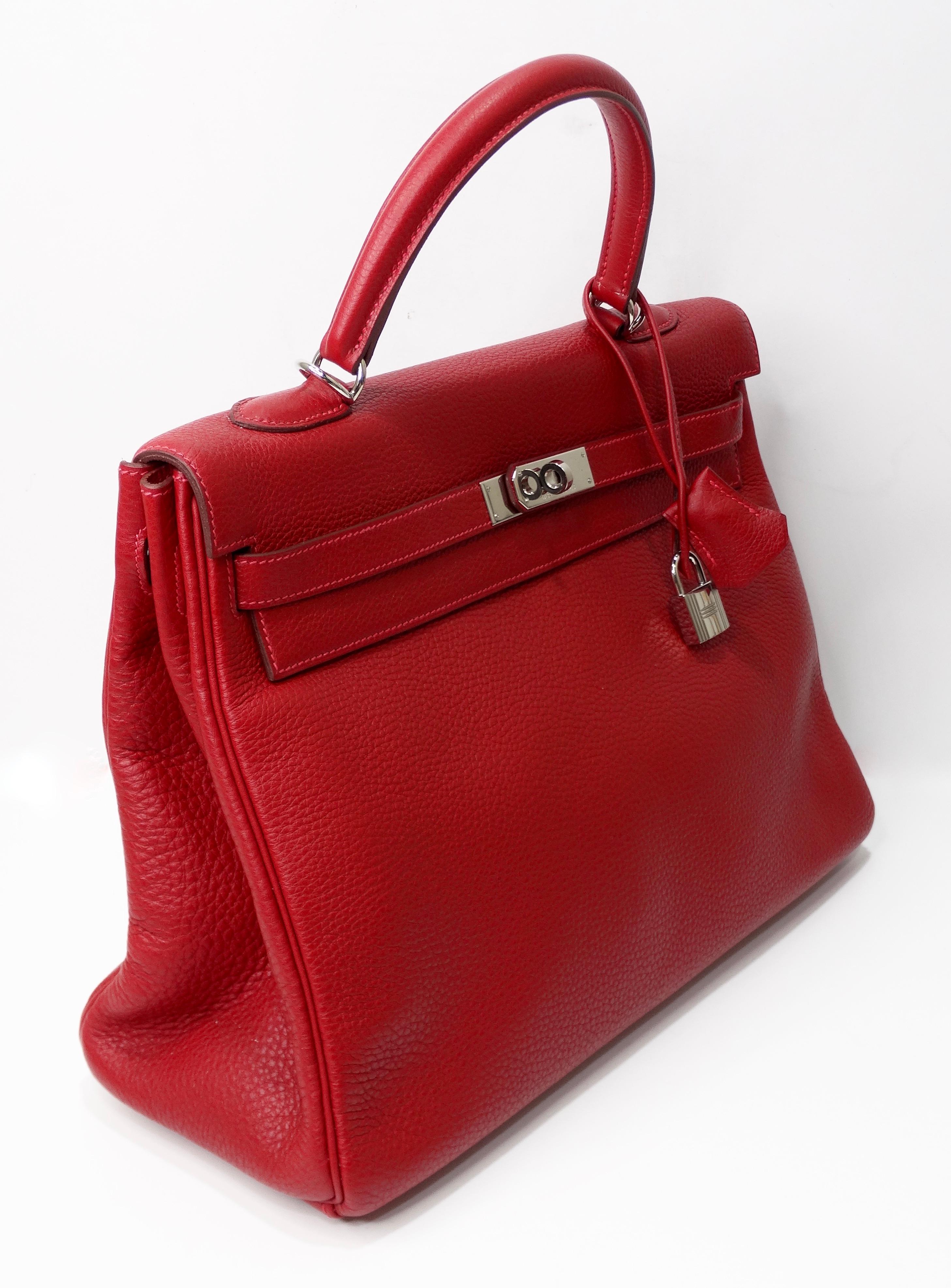 Hello Hermés! Handcrafted by the artisans of Hermes into an iconic 35cm Kelly from 2003. This beautiful Hermes Kelly handbag is crafted from togo leather in the iconic Hermés Rouge with Palladium hardware. Features pink stitching, single rolled top