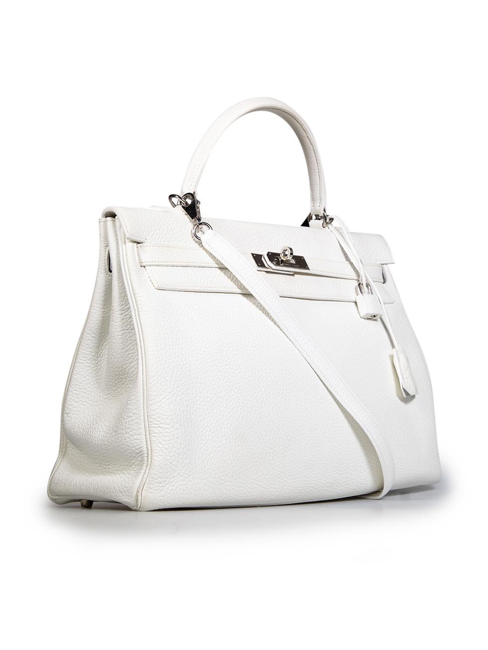 CONDITION is Good. Minor wear to bag is evident. Overall discolouration to the exterior of the bag especially the top handle, lock, clochette and flap, scratches are found on the hardware of the sangles, touret and feet. Minor scratches and