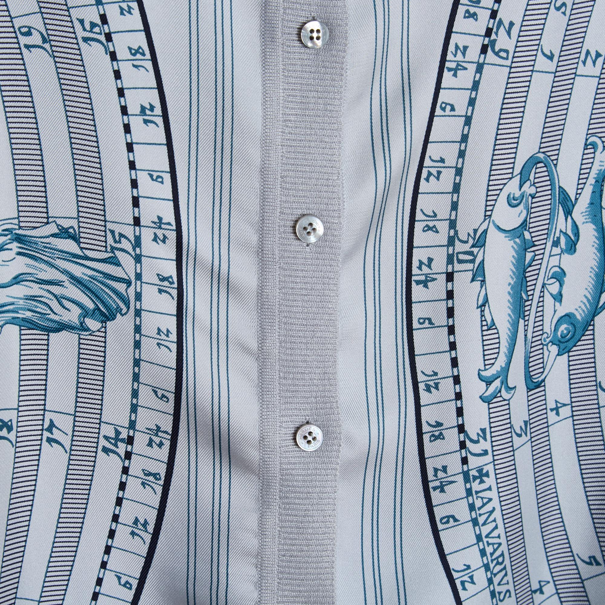 Hermès Twillaine series cardigan in pearl gray cashmere blend silk, front in silk twill with Dies and Hore Astrologie pattern by Françoise Faconnet (published in 1963 then 1988 and 2005 - probably like this cardigan), round neck closed by 8 small