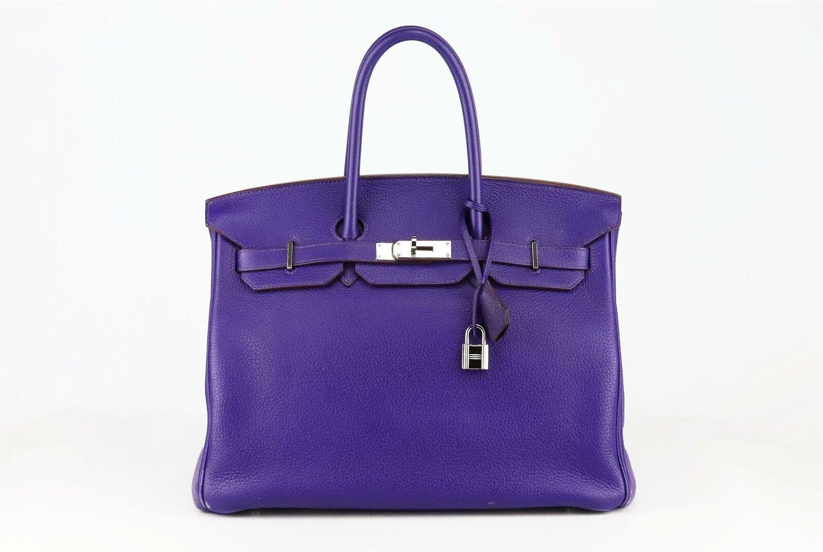 Made in France, this beautiful 2010 Hermès ‘Birkin’ 30cm handbag has been made from ‘Togo’ leather exterior in a purple/blue hue and matching leather interior, this piece is decorated with palladium hardware on the front and finished with top