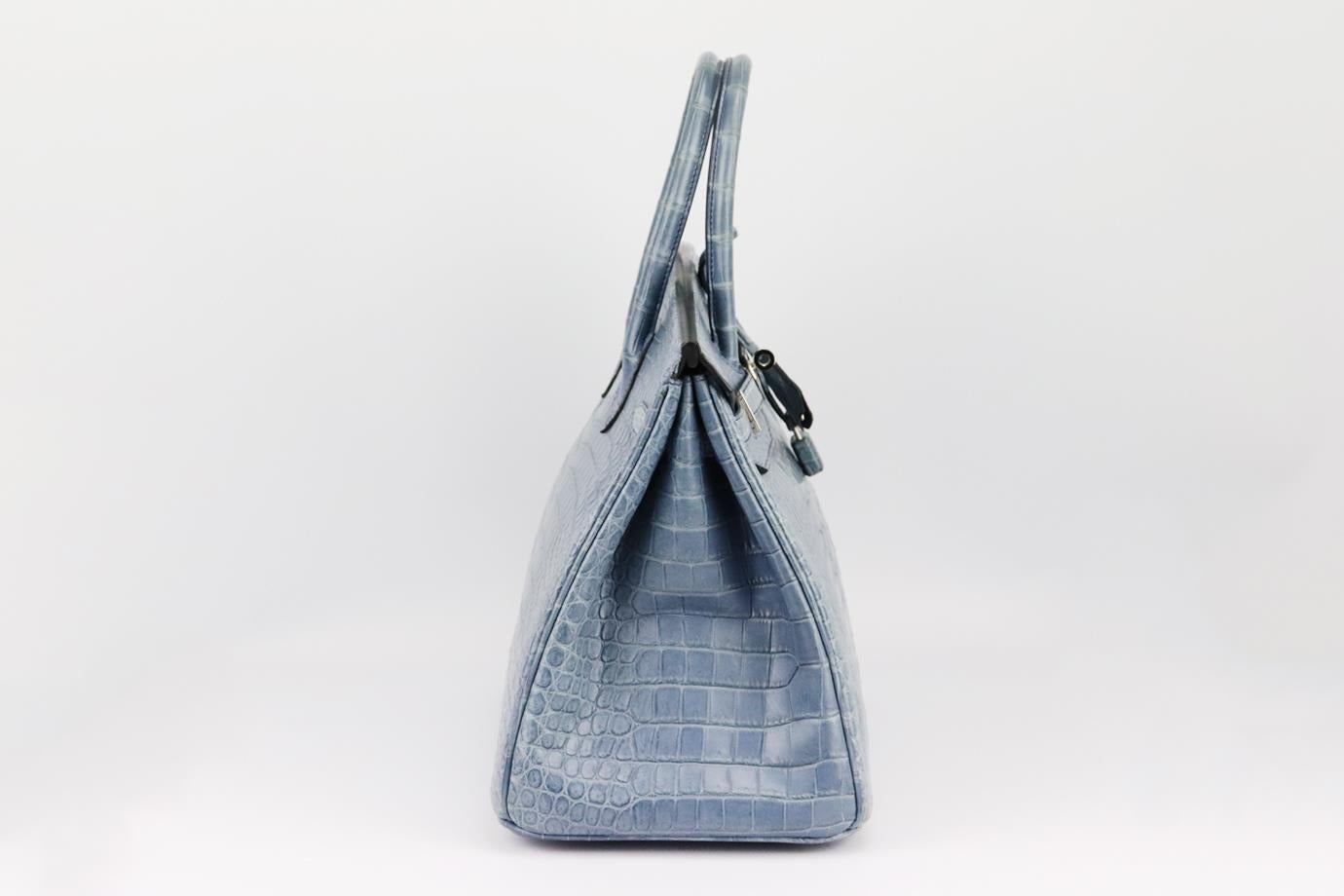 Hermès 2010 Birkin 35cm matte Crocodile Porosus leather bag. Made in France, this beautiful 2010 Hermès ‘Birkin’ handbag has been made from dusty-blue ‘Crocodile Porosus’ exterior in ‘Bleu Jean’ with matching leather interior, this piece is