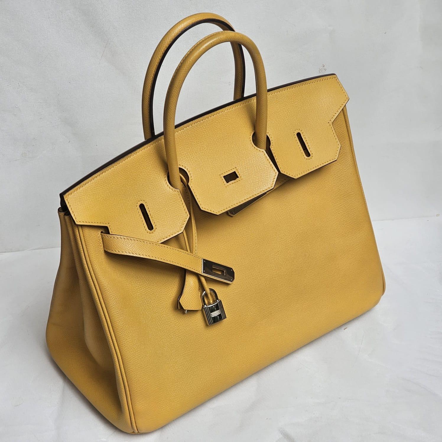 Classic Hermes birkin 35 in jaune soleil epsom leather with palladium hardware. Stamp square N (2010). Overall in good condition, with light rubbing on the corners. The bag structure is still sturdy. Comes with its tools, dust bag, raincoat and copy