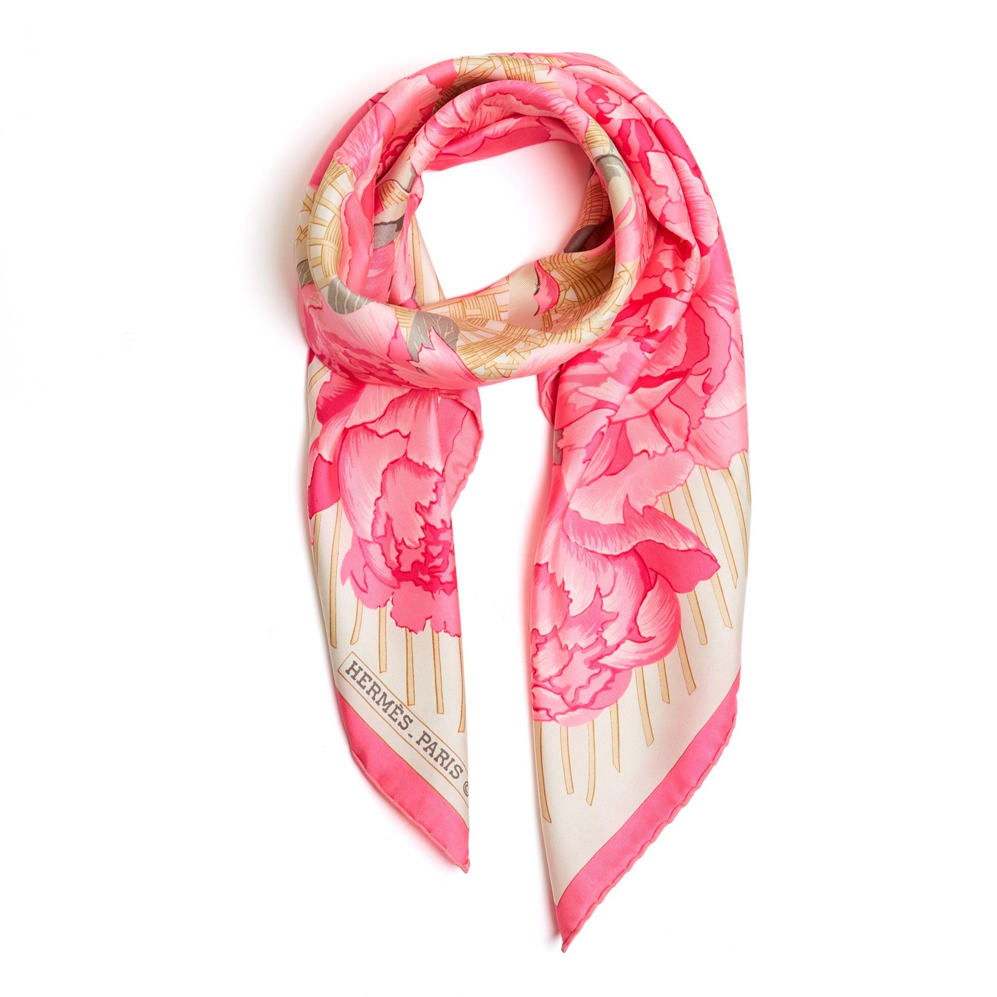 Hermès square scarf 90 in silk twill, Les Pivoines pattern by Christiane Vauzelles, published in 1977 and reissued in 1990 (then in 2006 in a version without caning), in shades of bright pink and gold on an ecru background, pink edges. Width 90 cm x