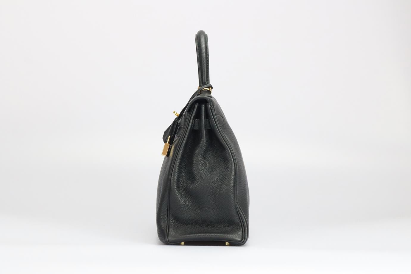 <ul>
<li>Hermès 2011 Kelly Retourne 35Cm Togo Leather Bag.</li>
<li>Black.</li>
<li>Twist lock fastening - Front.</li>
<li>Comes with - key, lock and clochette.</li>
<li>Does not come with - dustbag or box.</li>
<li>Model: Kelly 35.</li>
<li>Made in