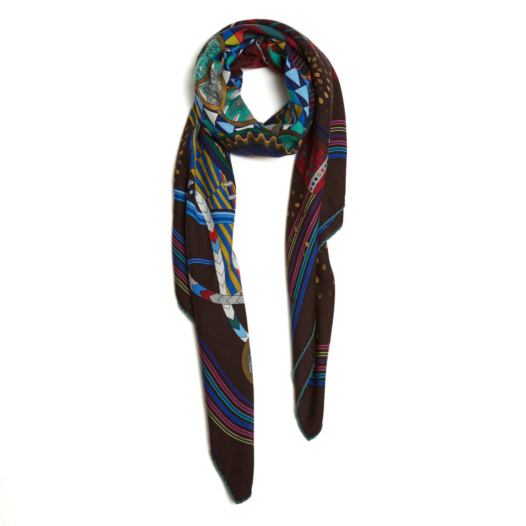 Hermès square scarf 140 shawl in cashmere twill (70%) and silk, Le Laboratoire du Temps pattern by Pierre Marie, published in 2012 (like this one) and re-published in 2014, in shades of red and blue on dark brown, hand-rolled edge contrasting green.