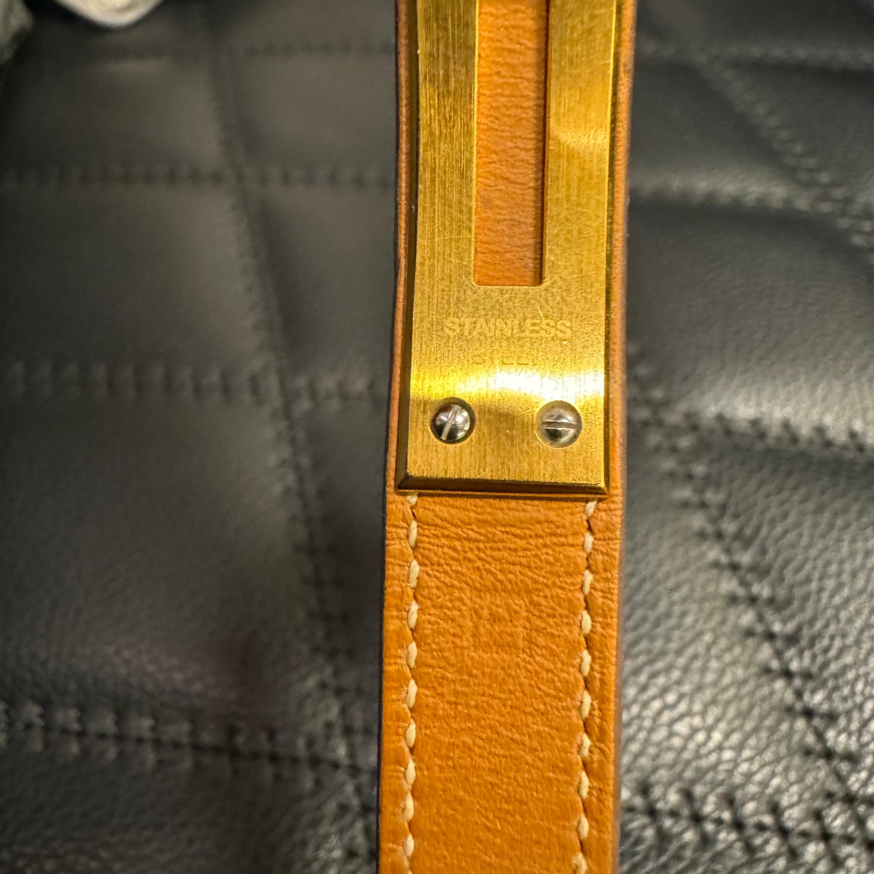 Hermes 2012 kelly double tour bracelet watch in gold smooth leather. Comes as is. Visible scuffing and chipping on the gold hardware. There are stains and scratch marks on the leather surface. Watch is working.