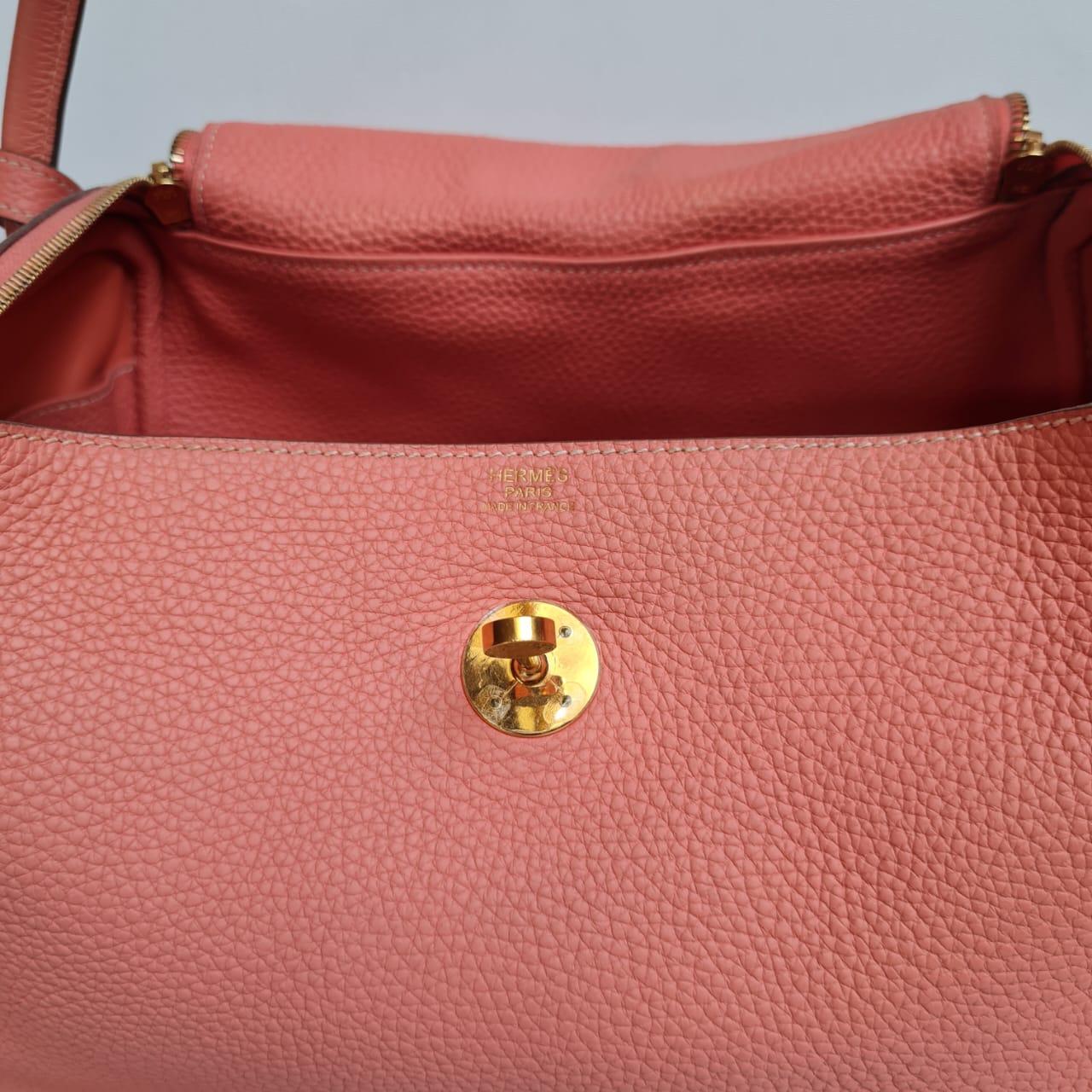 Beautiful lindy 30 in crevette clemence leather with gold hardware. Pink-peach flamingo color, really beautiful color to add to your collection. Overall still in excellent condition. Comes with its dust bag and rain coat. Print of copy receipt