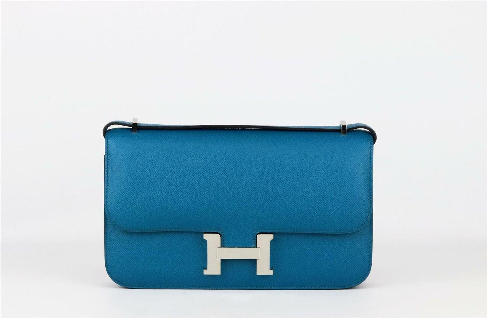 Made in France, this beautiful 2014 Hermès ‘Constance Elan’ handbag has been made from textured Epsom leather exterior in a teal/turquoise hue and soft leather interior, it is decorated with palladium hardware on the front and finished with a flat