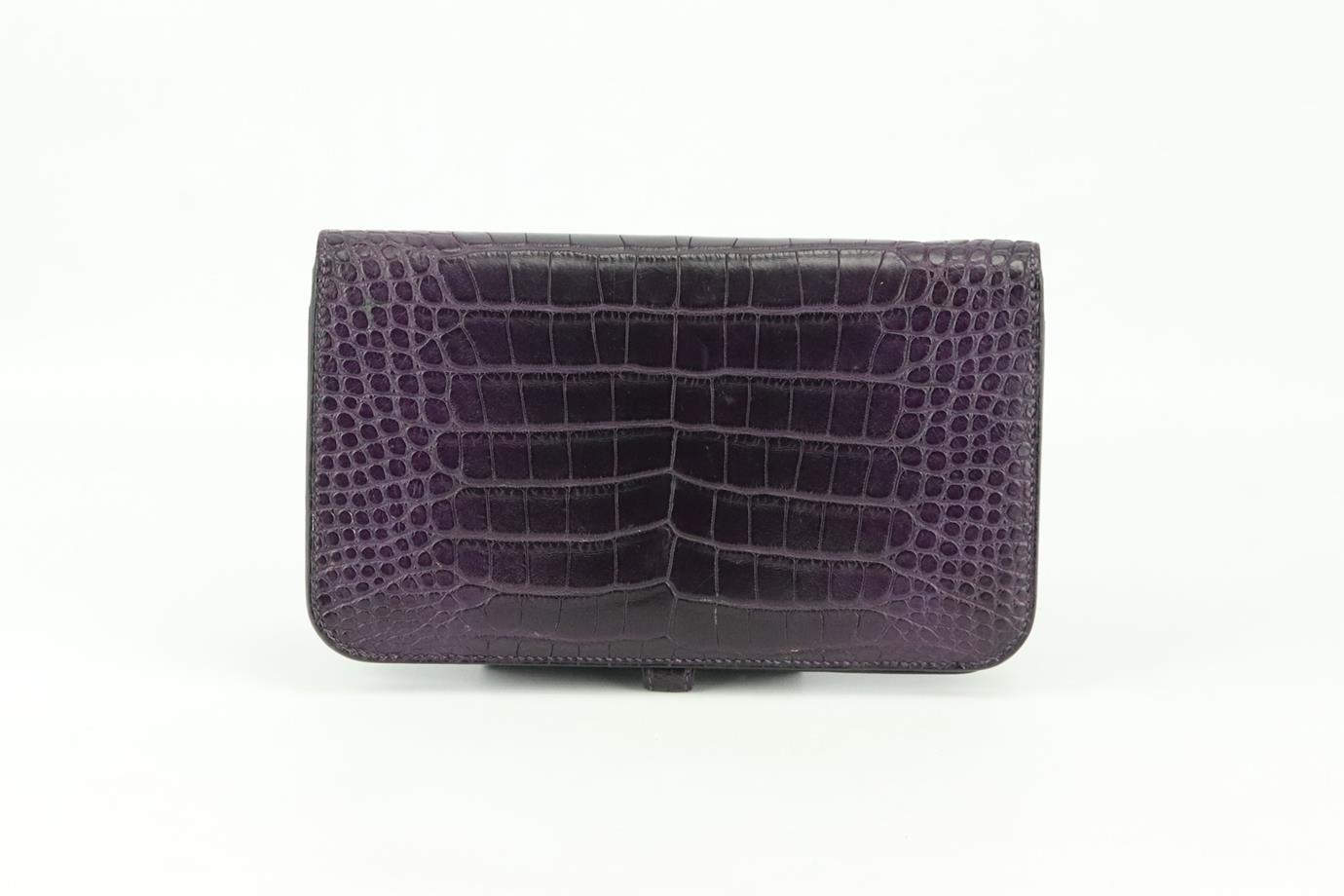 Hermès 2014 Dogon Duo Alligator Mississippiensis and leather wallet. Made from matte Alligator Mississippiensis exterior in rich-purple and matching leather interior, it is decorated with palladium hardware on the front flap and finished with 5 card