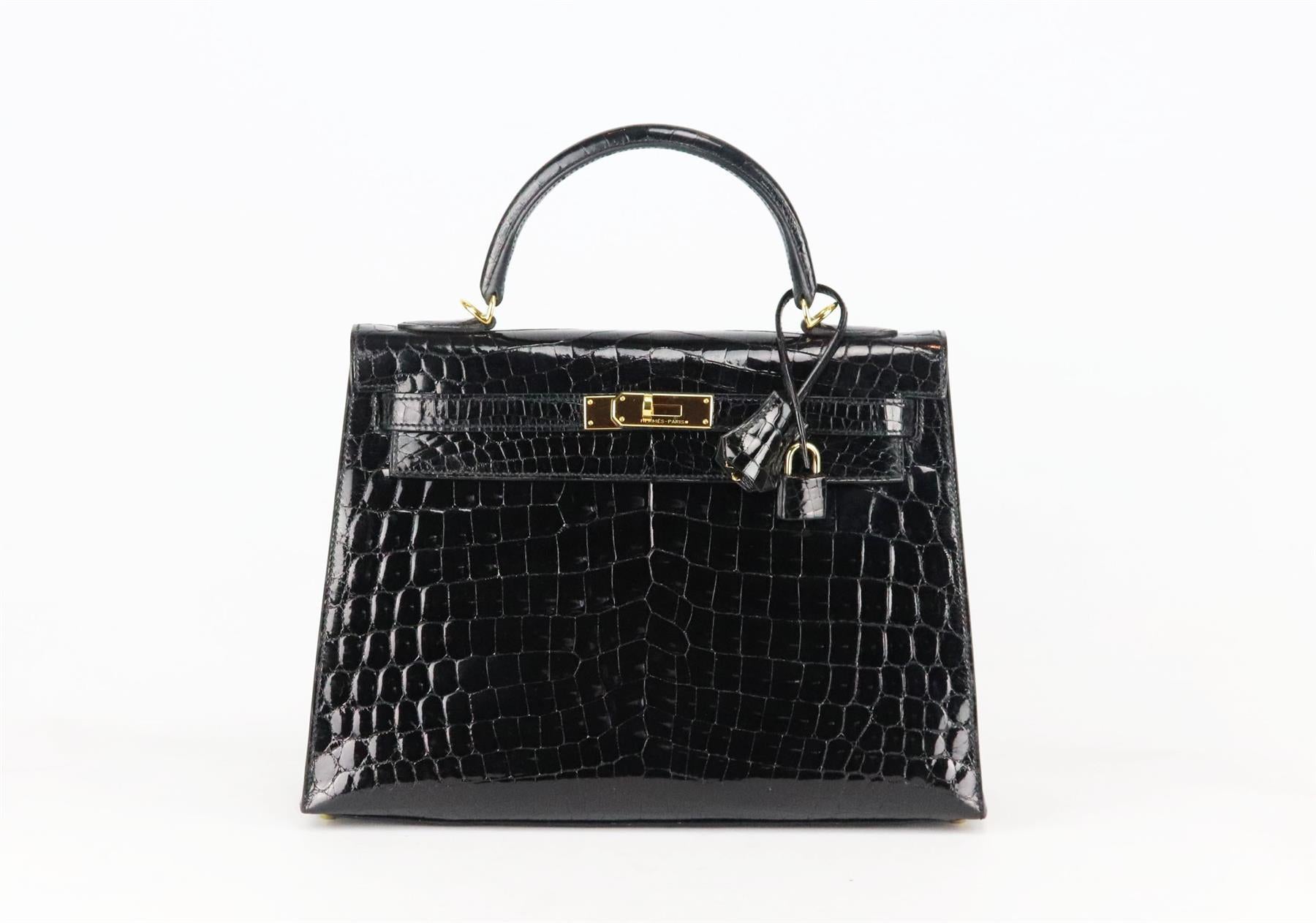 <ul>
<li>Made in France, this beautiful 2014 Hermès ‘Kelly Sellier’ 32cm handbag has been made from shiny Porosus Crocodile exterior in black and matching leather interior, this piece is decorated with gold hardware on the front and finished with