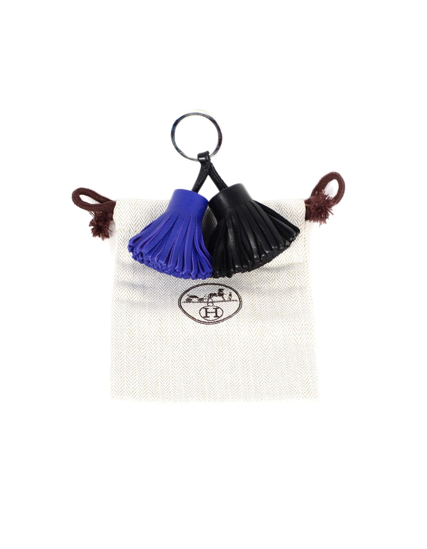 Hermes 2015 Black/Blue Electric Carmen Uno-Dos Key Ring W/ DB

Made In: France
Year of Production: 2015
Color: Black/blue
Hardware: Palladium 
Materials: Leather, metal
Closure/Opening: Key ring closure 
Overall Condition: Excellent pre-owned
