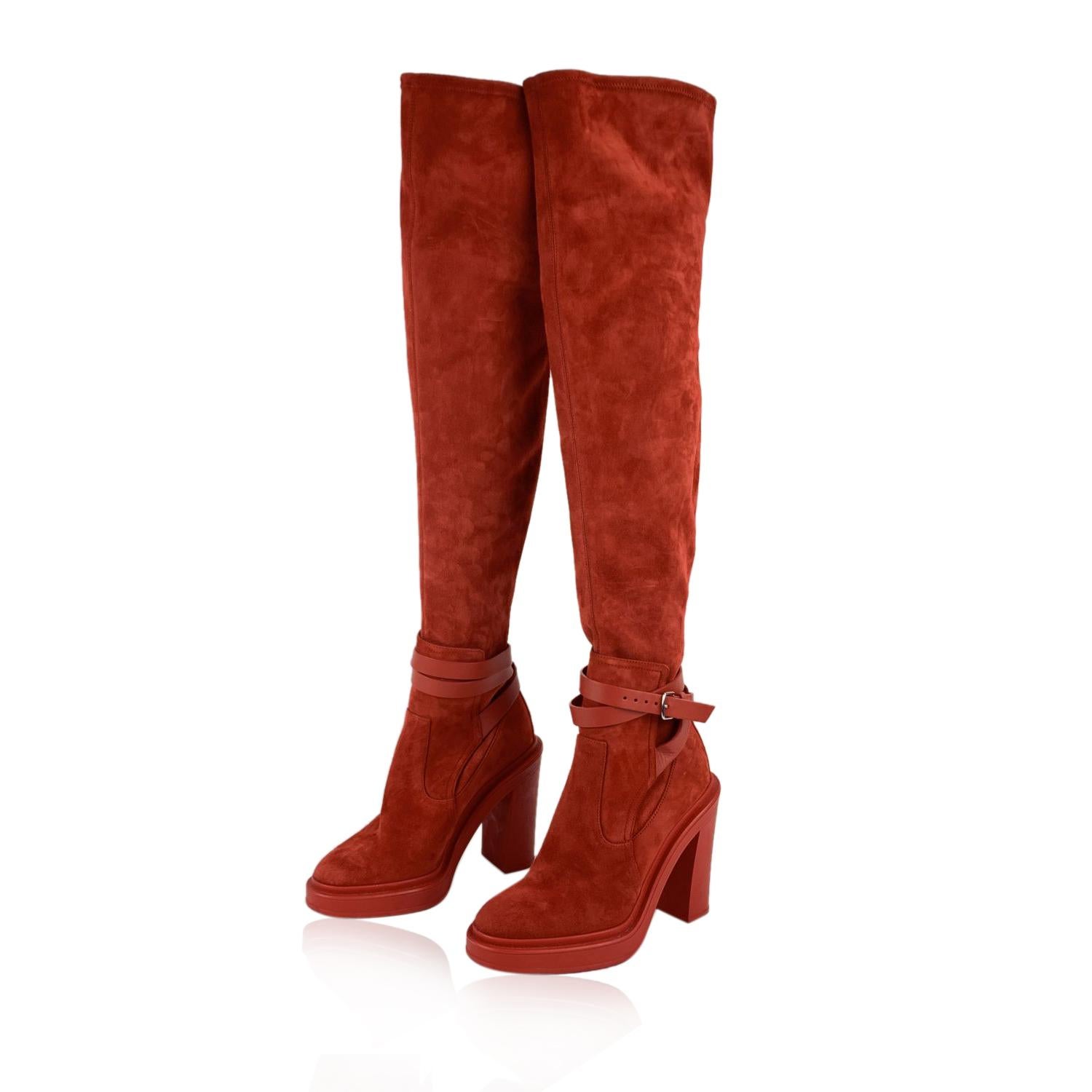 Beautiful Hermes 'Selena' Over-the-knee boots in red suede from the 2018 Fall/Winter collection. They feature a round cap toe, pull-on style, leather wrap straps around the ankles with buckle closure and rubber sole and block heels. Heels Height: